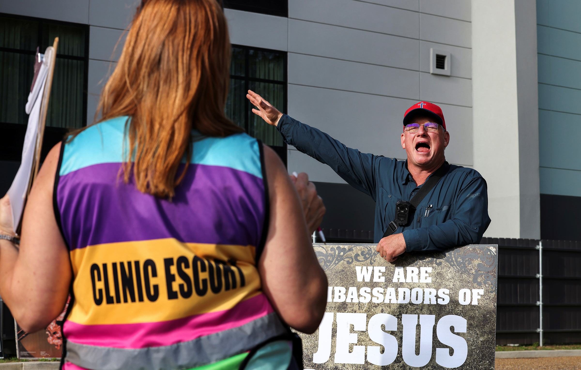 An anti-abortion protestor argues with volunteer clinic escort Kim Gibson outside the Jackson Women's Health Organization in Mississippi, May 2021