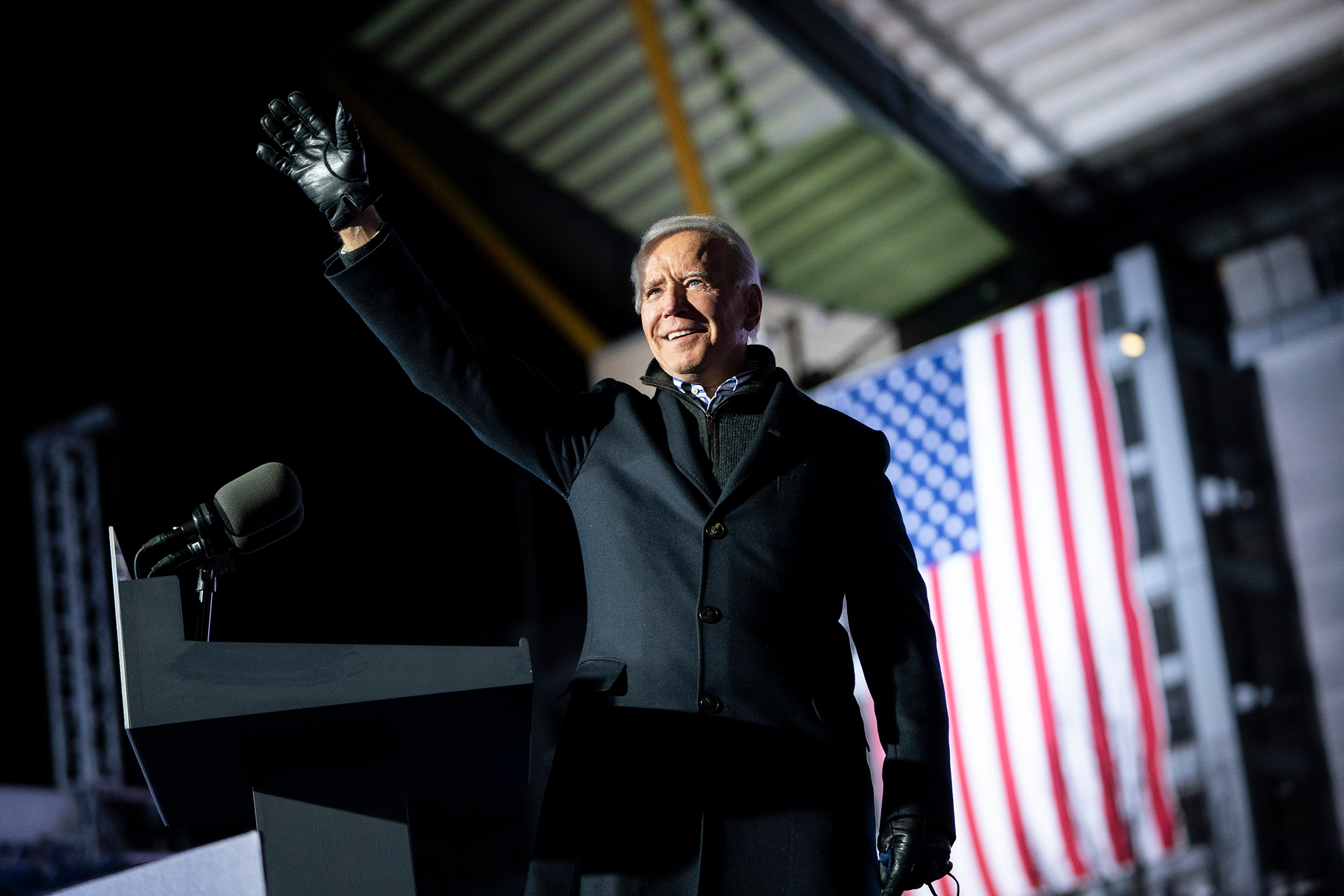 Joe Biden waves to the crowd as he arrives at a drive-in campaign rally at Heinz Field in Pittsburgh on Nov. 2, 2020.