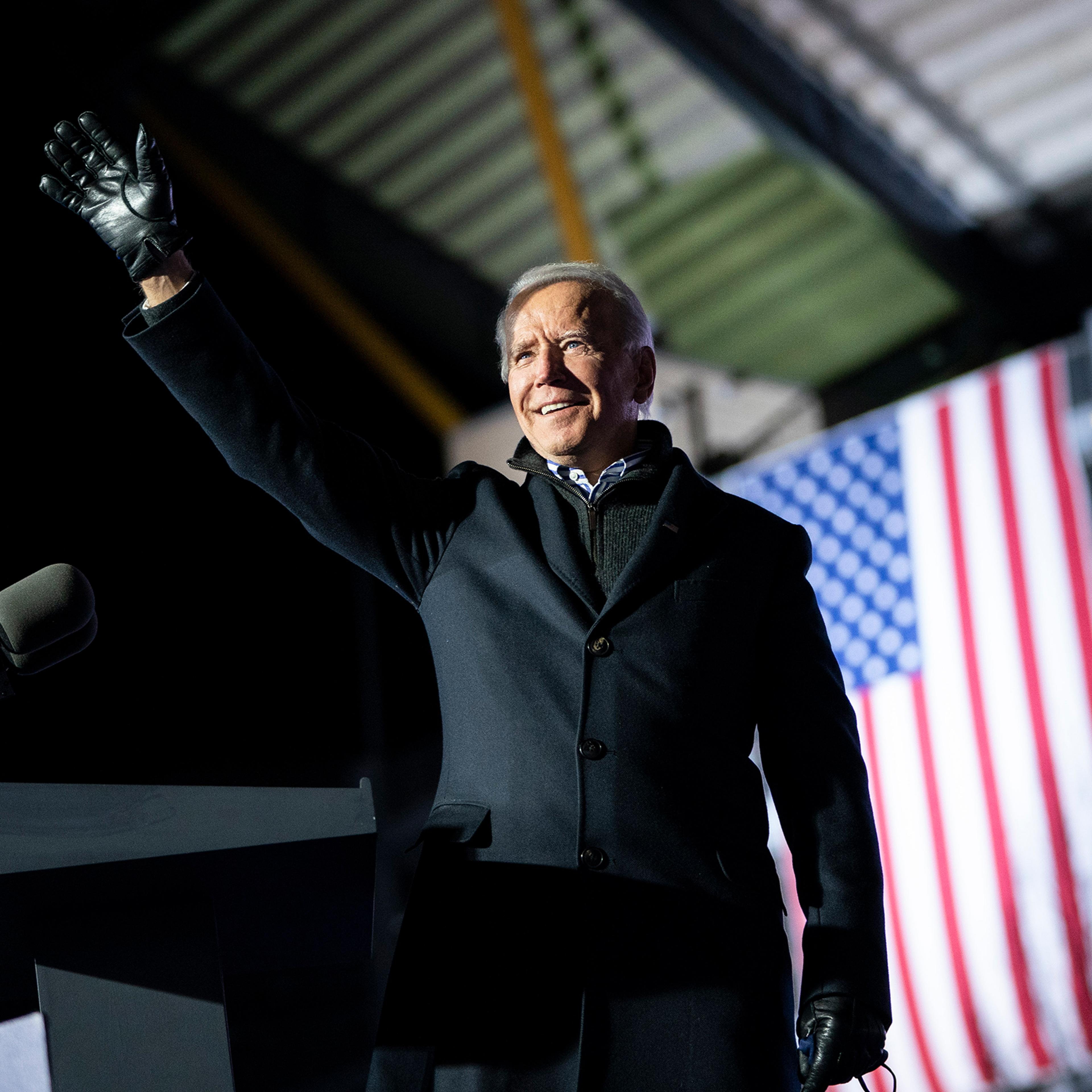 Joe Biden waves to the crowd as he arrives at a drive-in campaign rally at Heinz Field in Pittsburgh on Nov. 2, 2020.