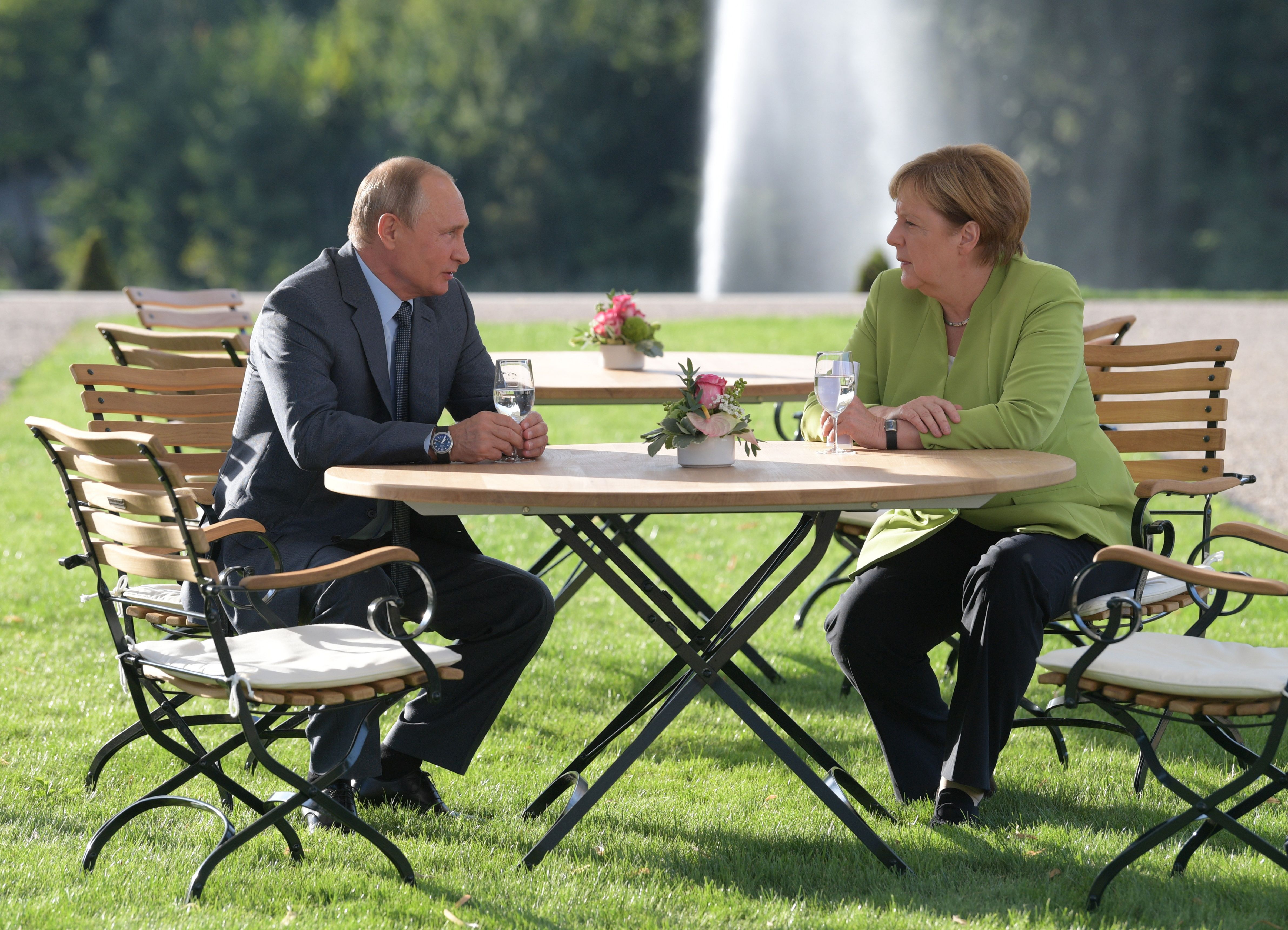 Putin and Merkel at their talk