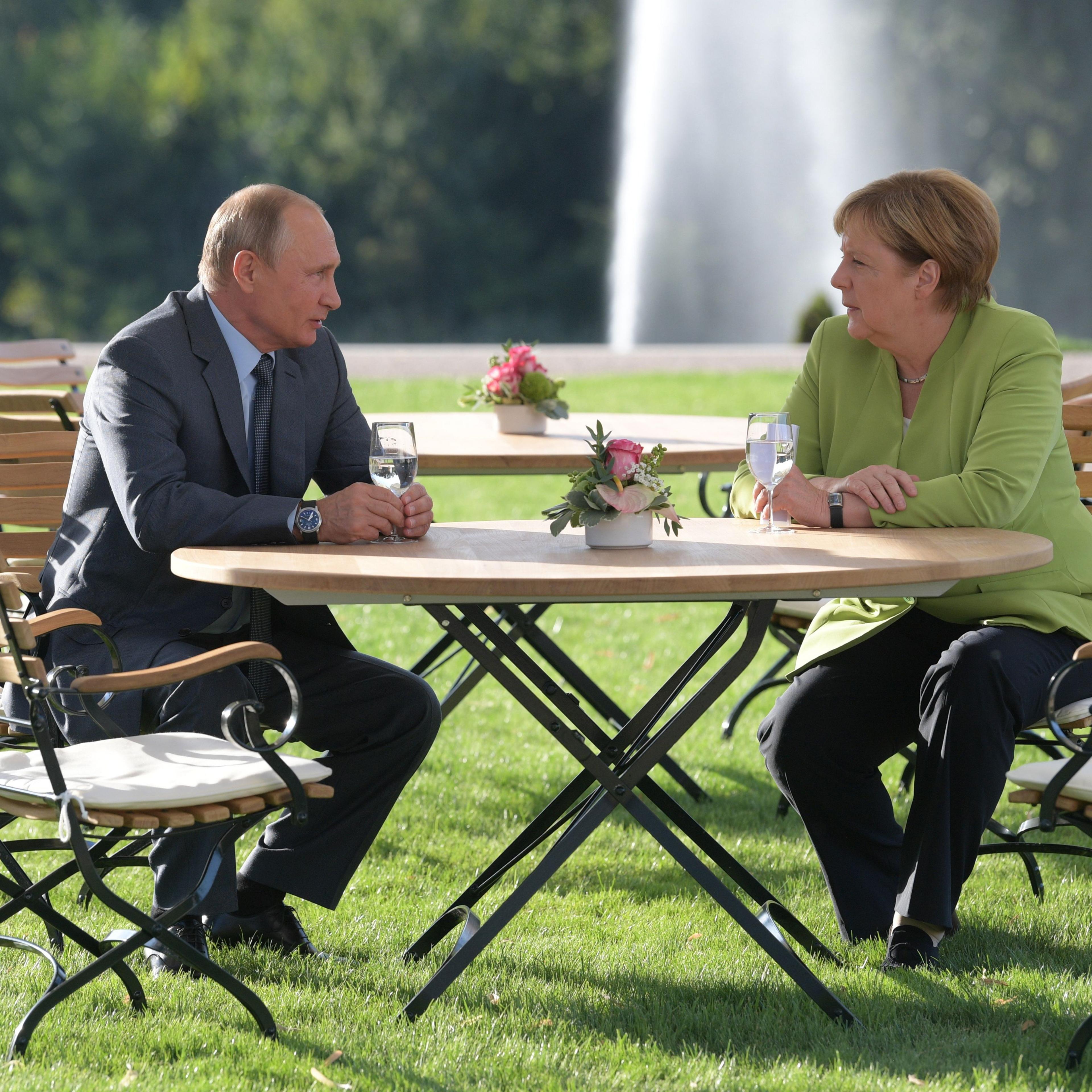 Putin and Merkel at their talk