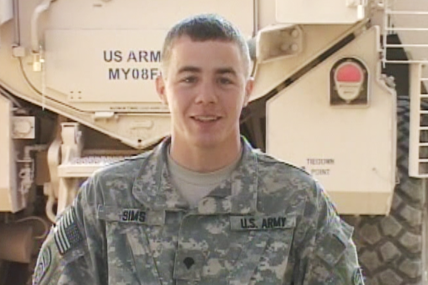 Army Specialist Isaac Sims is seen here in a holiday greeting he sent from Ramadi, Iraq in 2009.