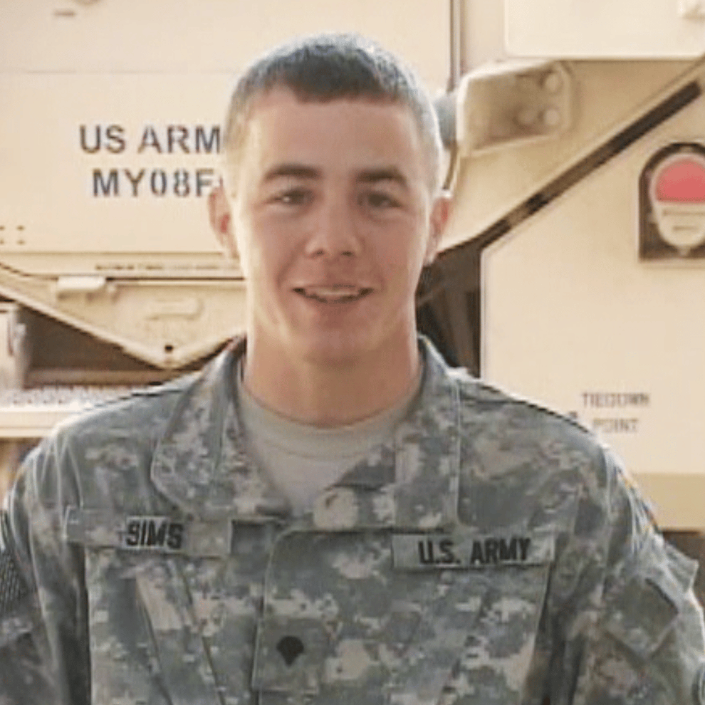 Army Specialist Isaac Sims is seen here in a holiday greeting he sent from Ramadi, Iraq in 2009.