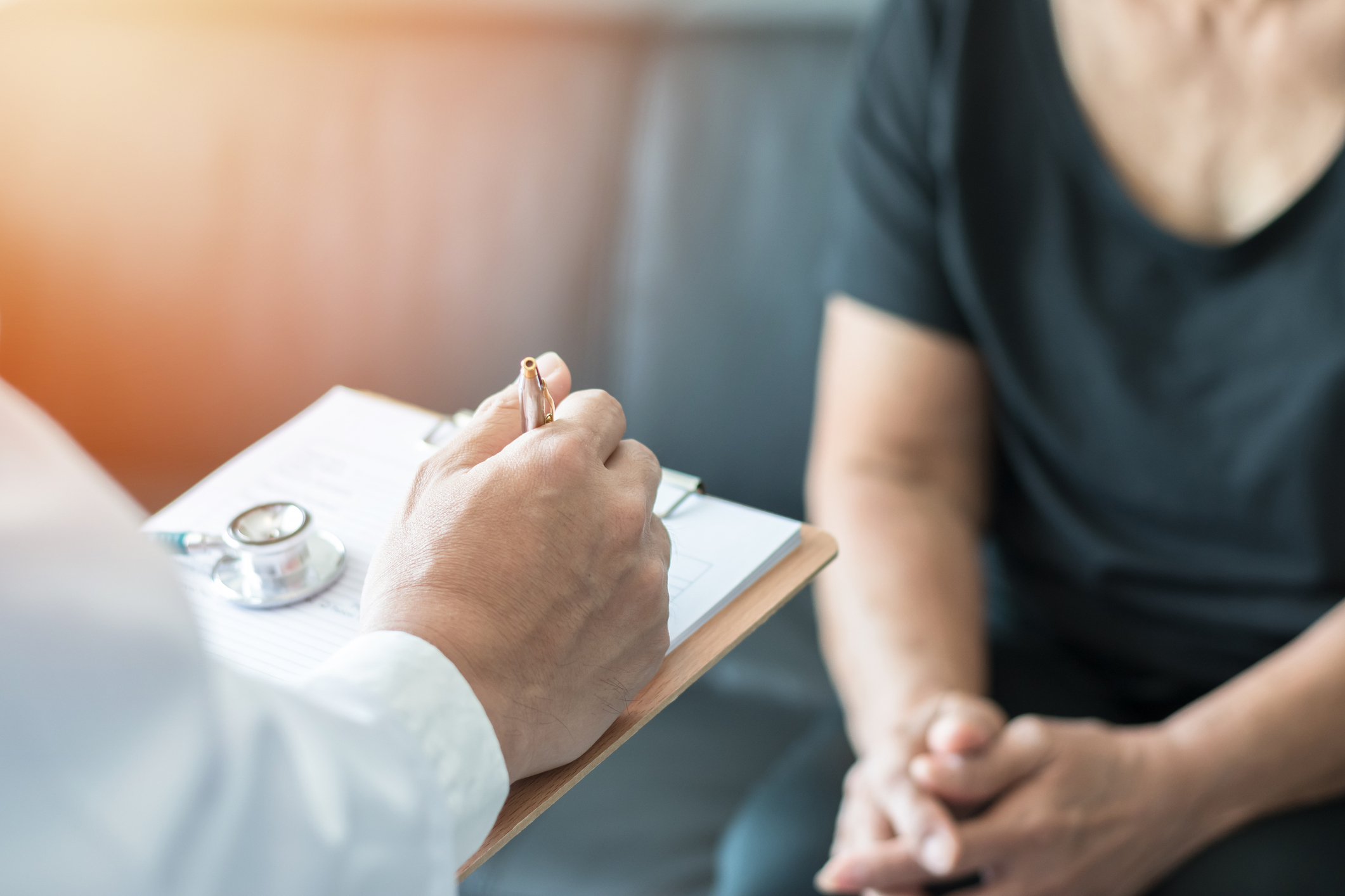 Geriatric doctor giving cognitive assessment