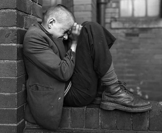 06-Youth-on-wall-Jarrow-Tyneside,-1976-Chris-Killip-Martin-Parr