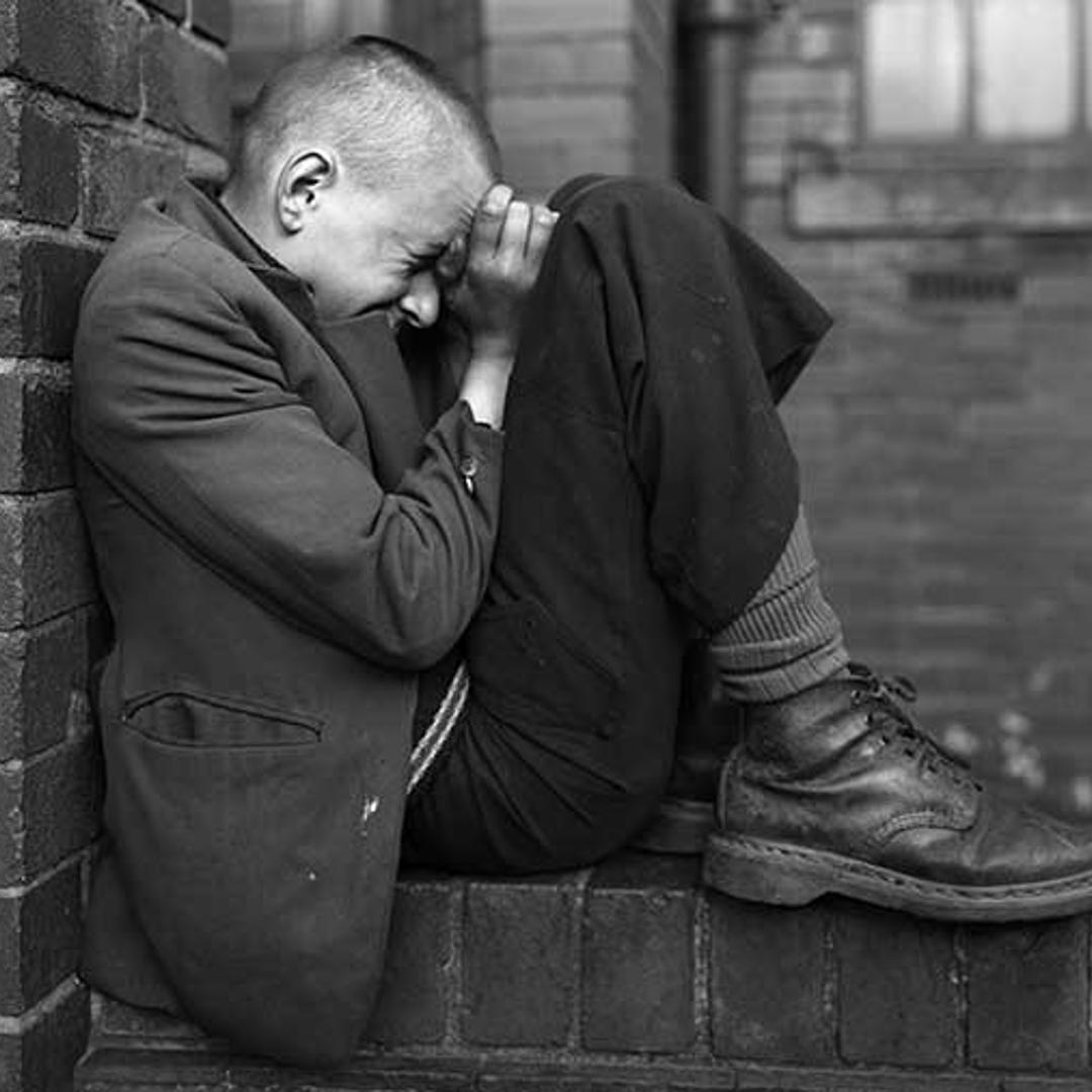 06-Youth-on-wall-Jarrow-Tyneside,-1976-Chris-Killip-Martin-Parr