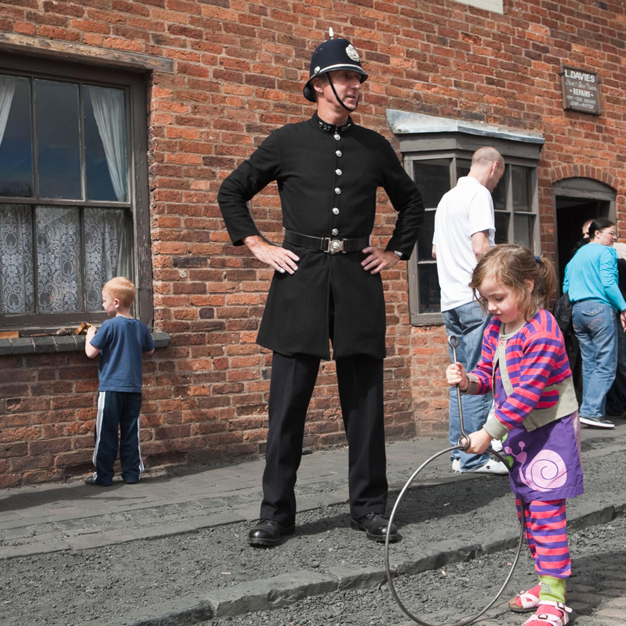 Dudley, The Black Country, England. An area in the midlands, The Black Country gained its name in the mid 19th century due to the smoke from the many thousands of ironworking foundries and forges. Street games at the Black Country Living Museum. 2011.