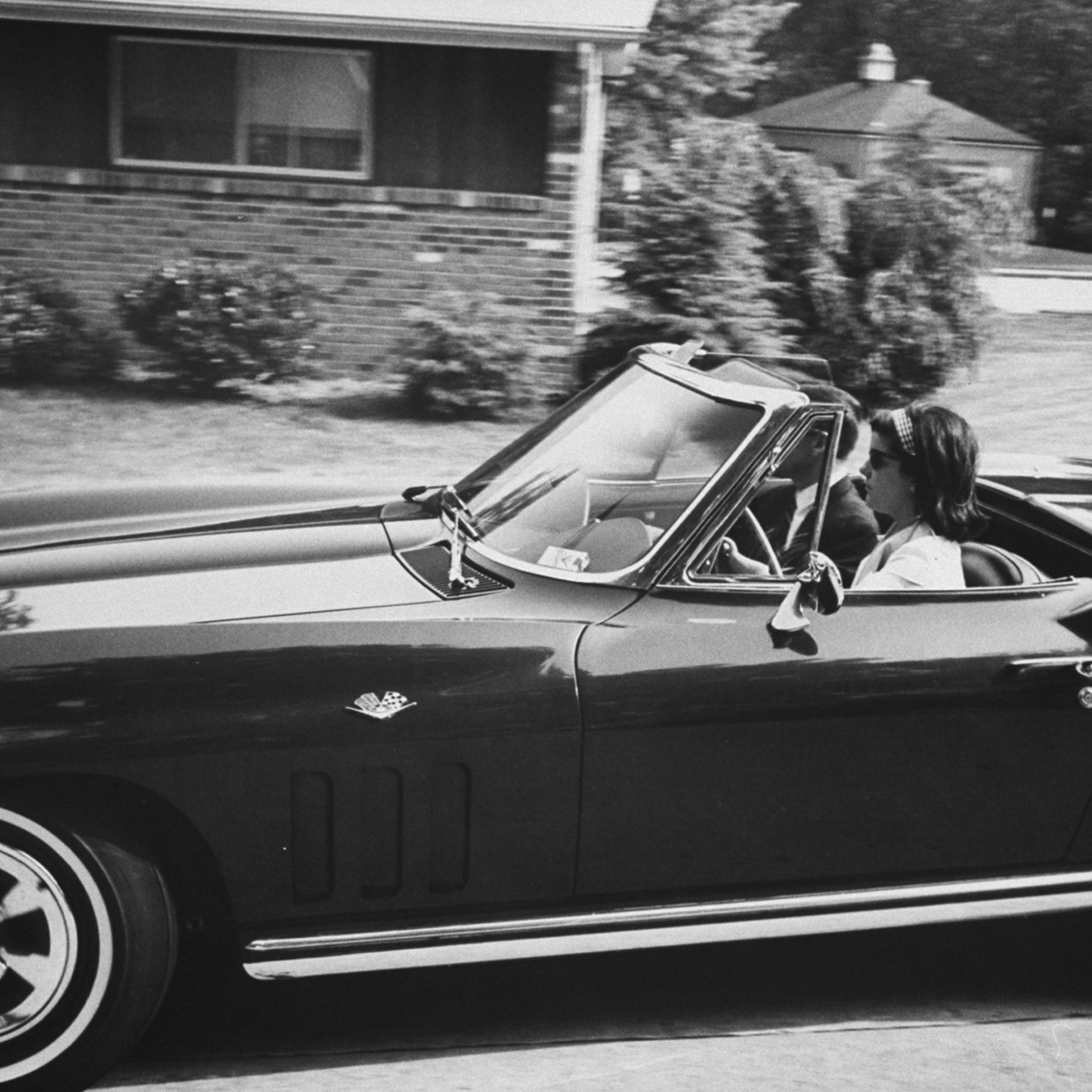 Luci Baines Johnson with Secret Service agent in her Corvette Stingray, 1965.