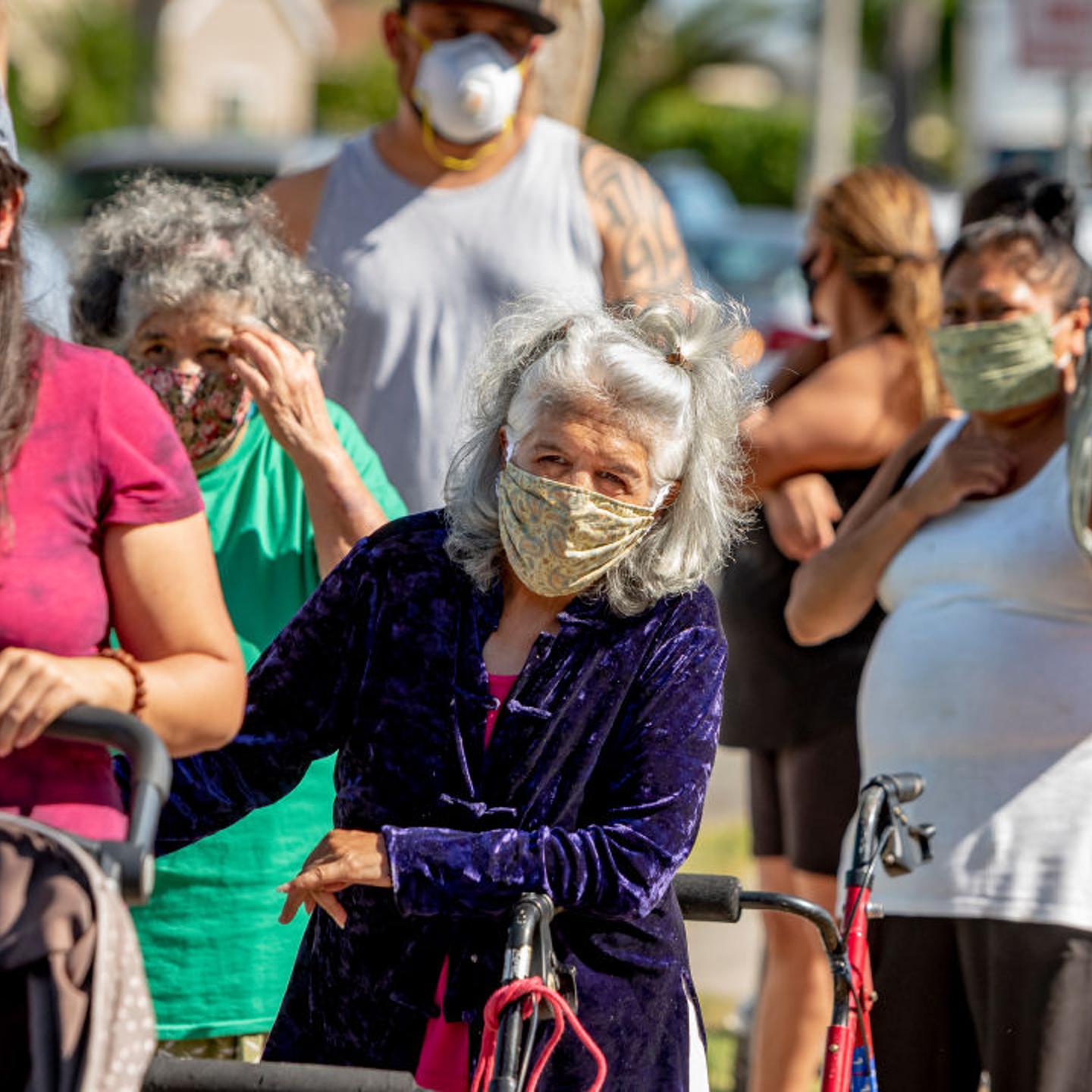People line up to receive free food in Anaheim, Calif. in July, 2020.