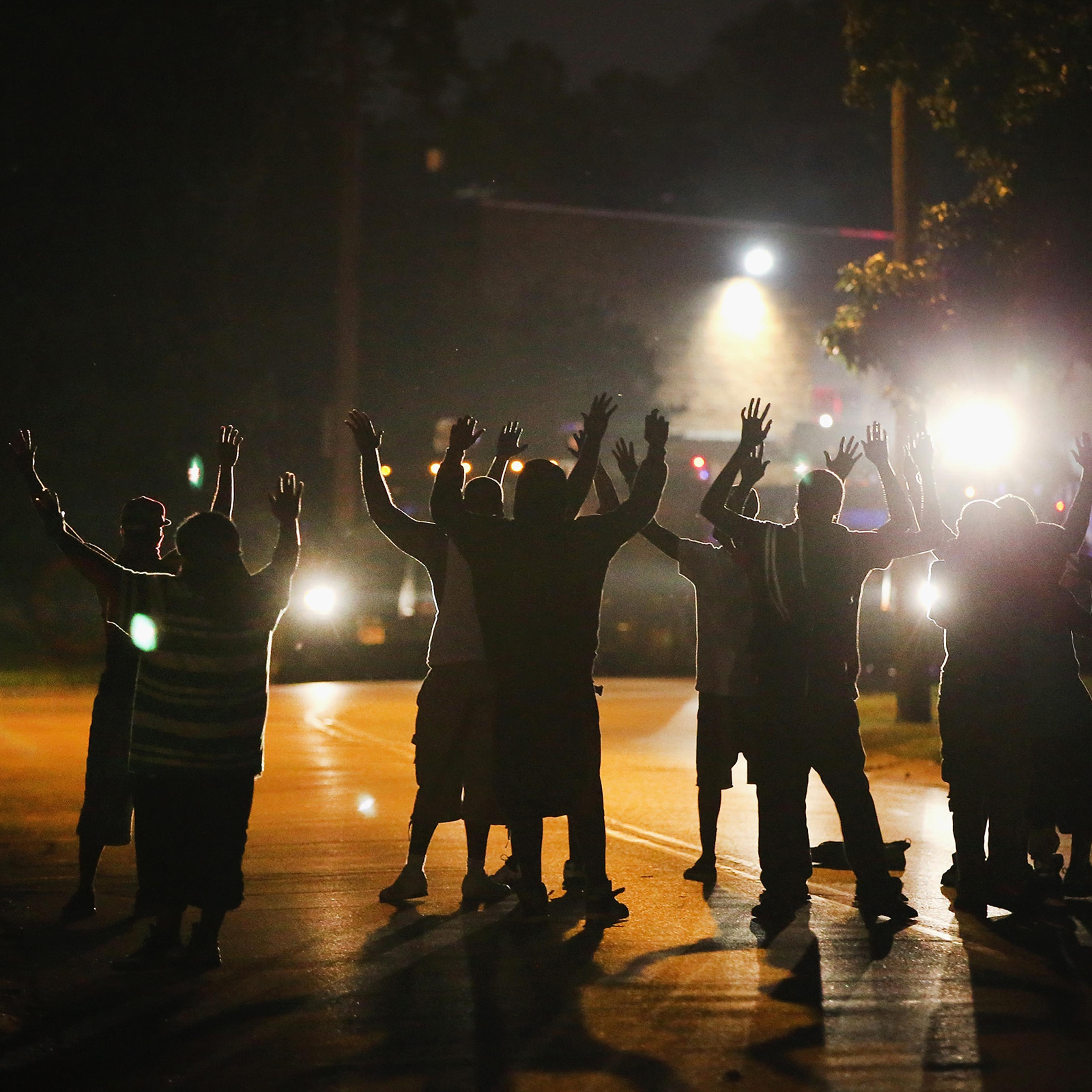 Police lock down a neighborhood in Ferguson amid protests in August 2014.