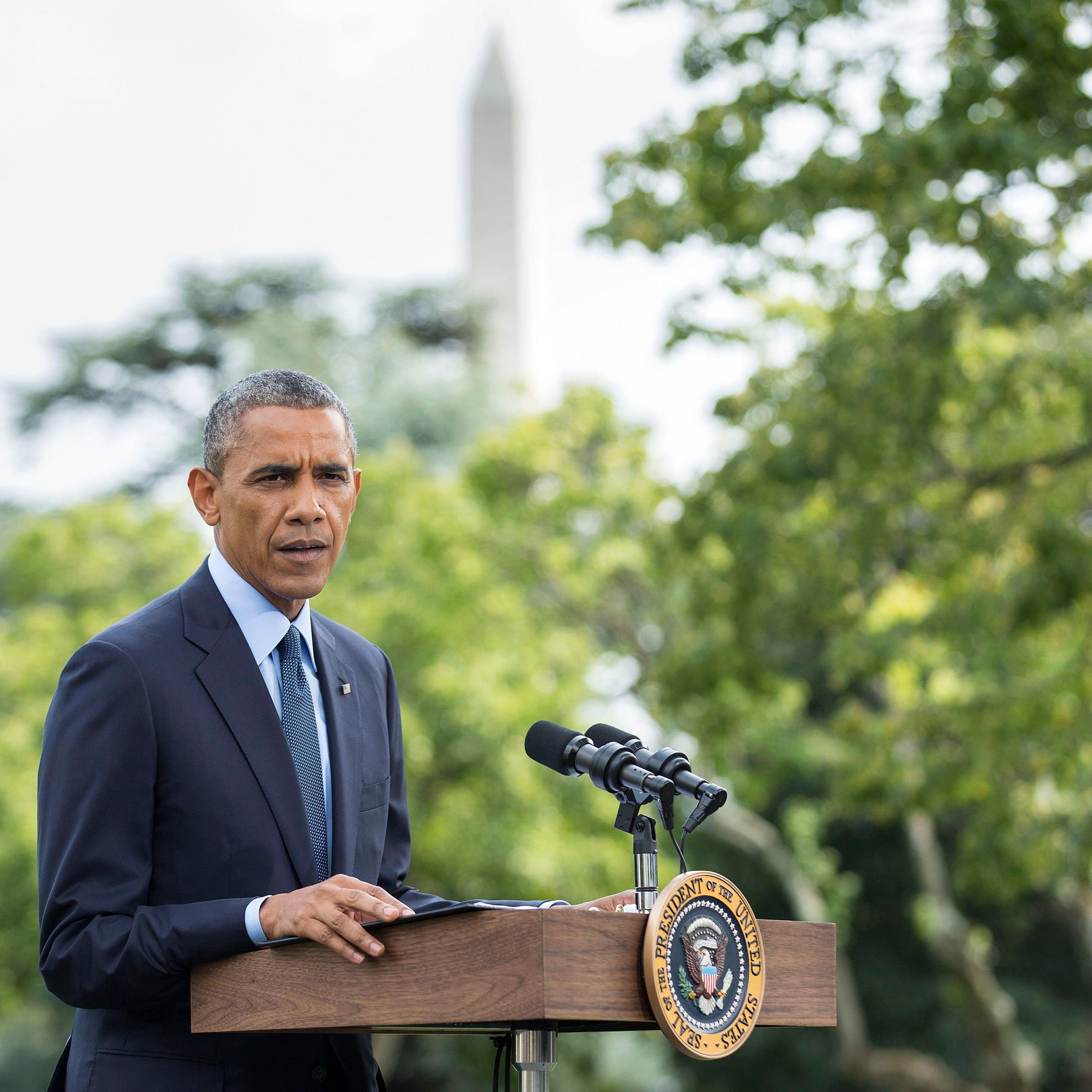 U.S. President Barack Obama speaks to reporters about new sanctions imposed on Russia as he departs the White House