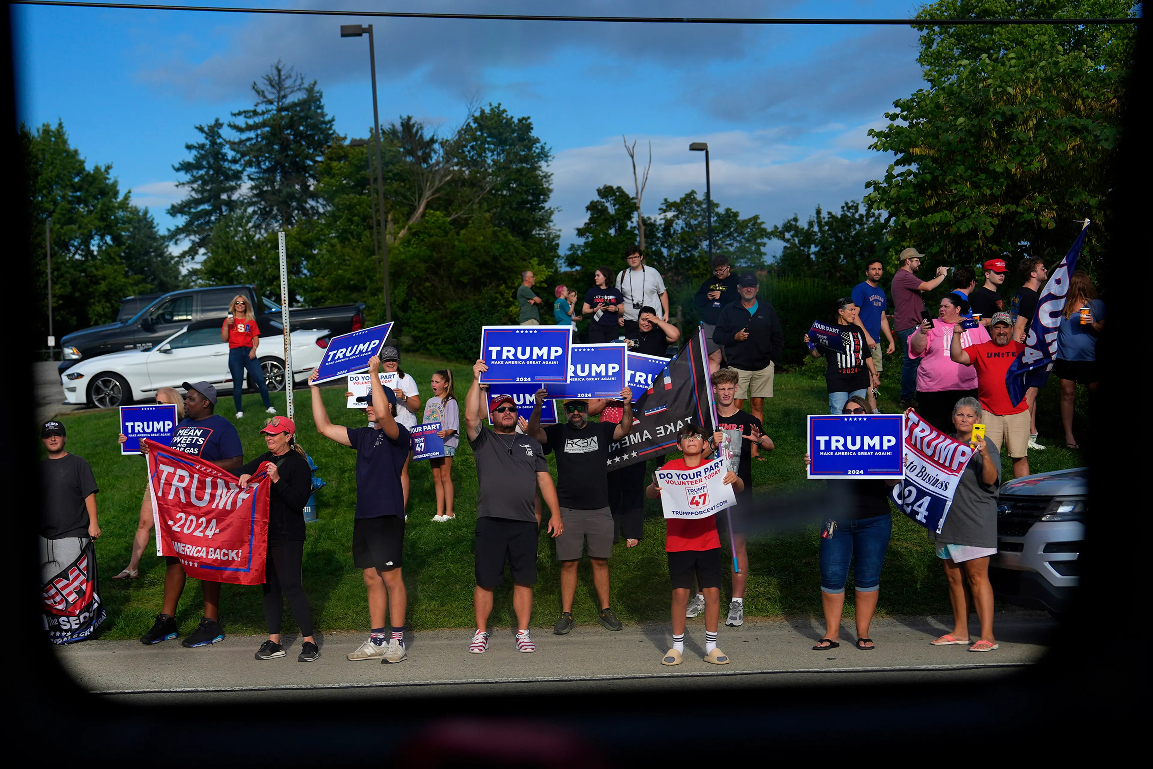 Trump backers, seen from Harris’ campaign bus, near Pittsburgh on Aug. 18