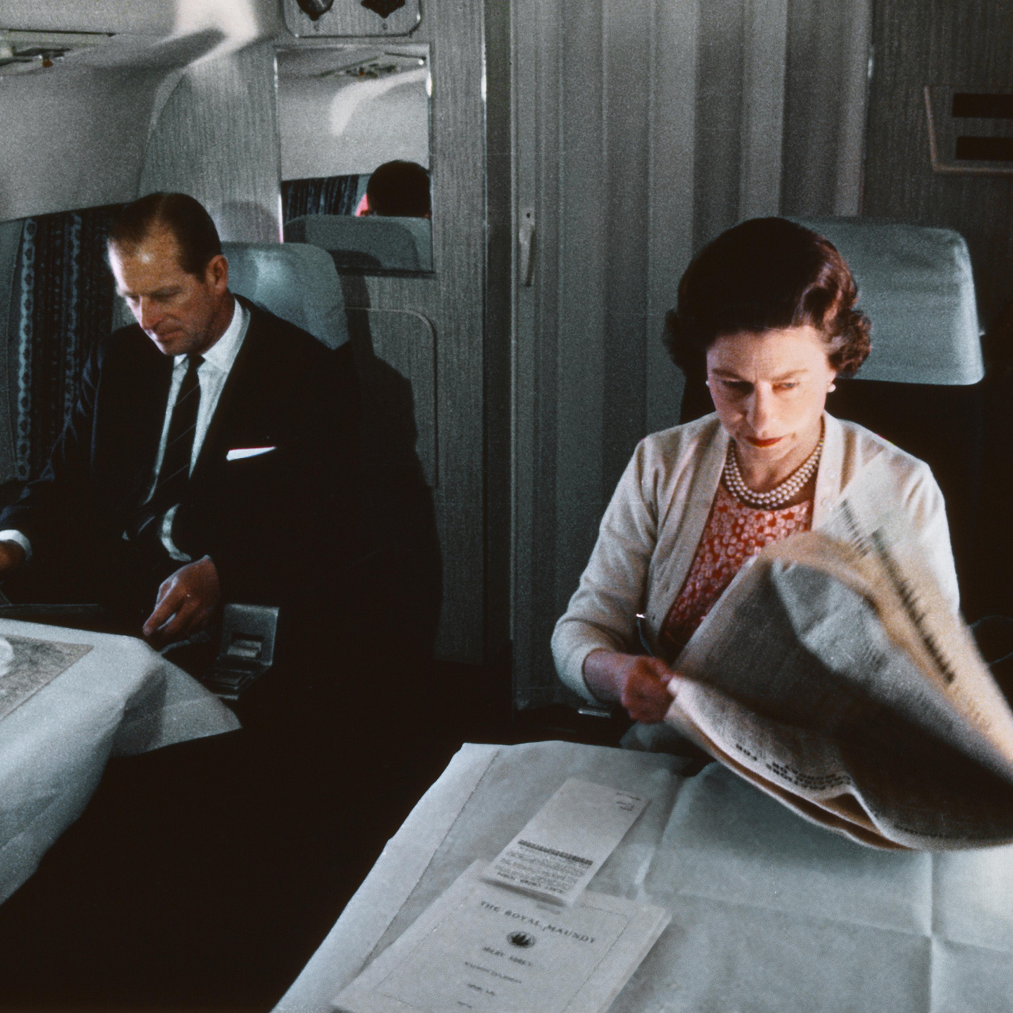 Queen Elizabeth II and Prince Philip fly back from a visit to Yorkshire in an Andover of the Queen's Flight, in a photo taken during the filming of the joint ITV-BBC film documentary The Royal Family, 1969.