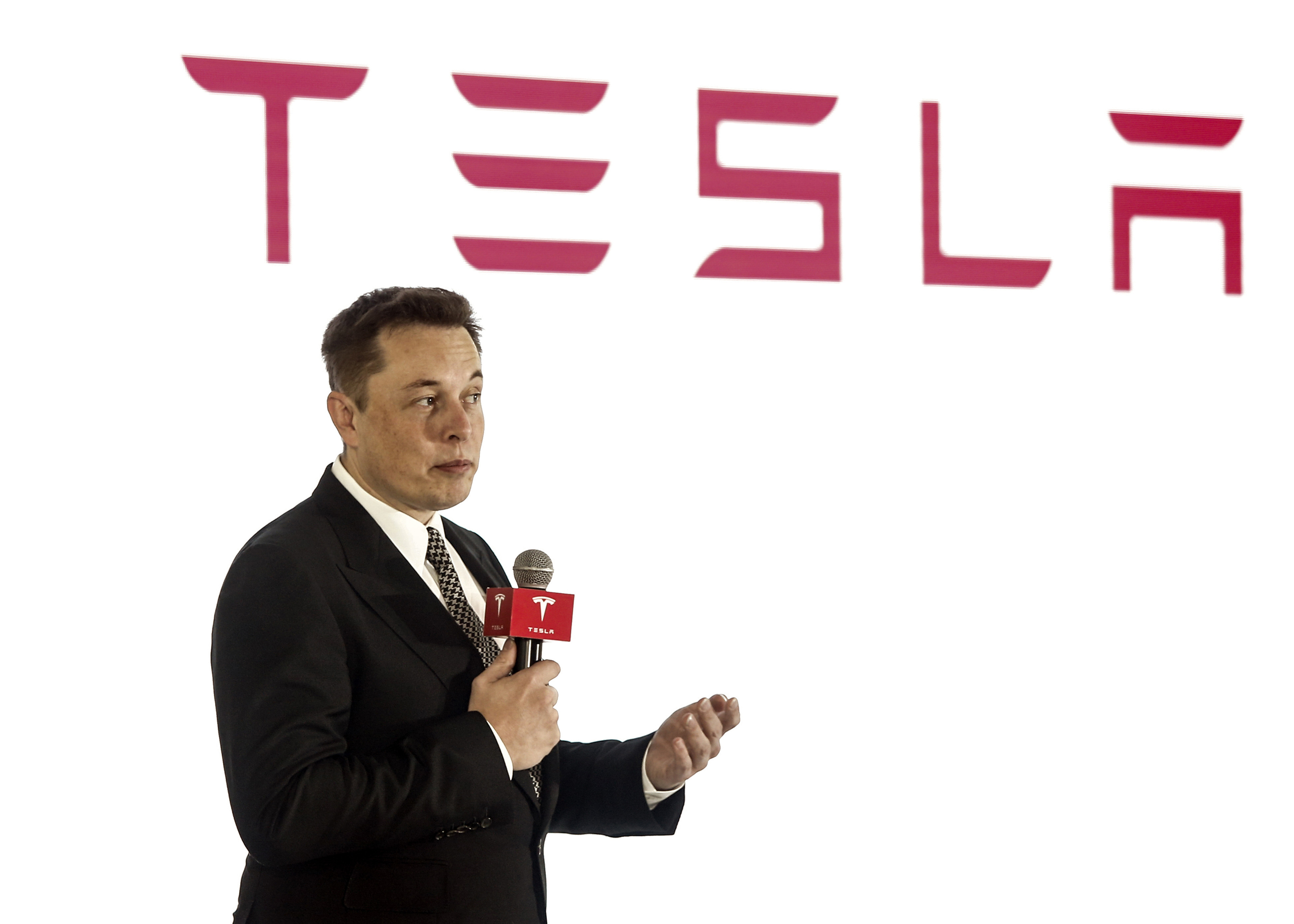 OCTOBER 23: (CHINA OUT) Elon Musk, Chairman, CEO and Product Architect of Tesla Motors, addresses a press conference to declare that the Tesla Motors releases v7.0 System in China on October 23, 2015. in Beijing, China. The v7.0 system includes Autosteer