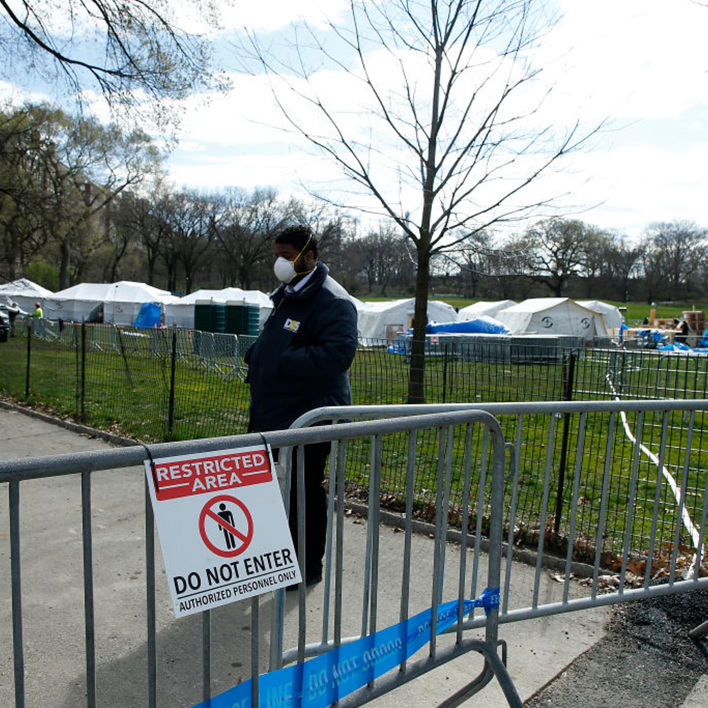 Security is posted at one of the access points to the temporary hospital built in Central Park on the East Meadow on April 2, 2020 in New York City.