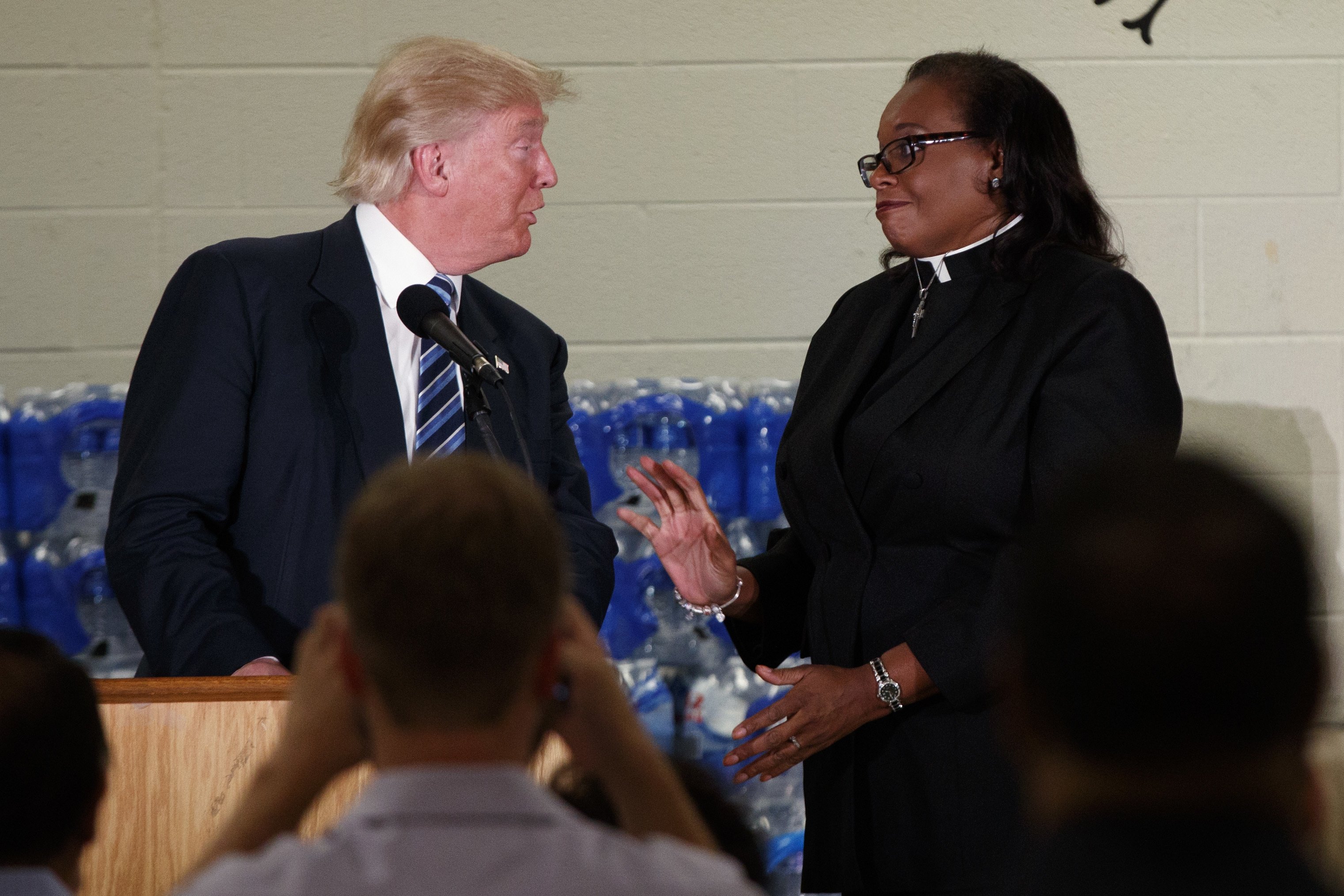 Rev. Faith Green Timmons interrupts Republican presidential candidate Donald Trump as he spoke during a visit to Bethel United Methodist Church, Sept. 14, 2016, in Flint, Mich.