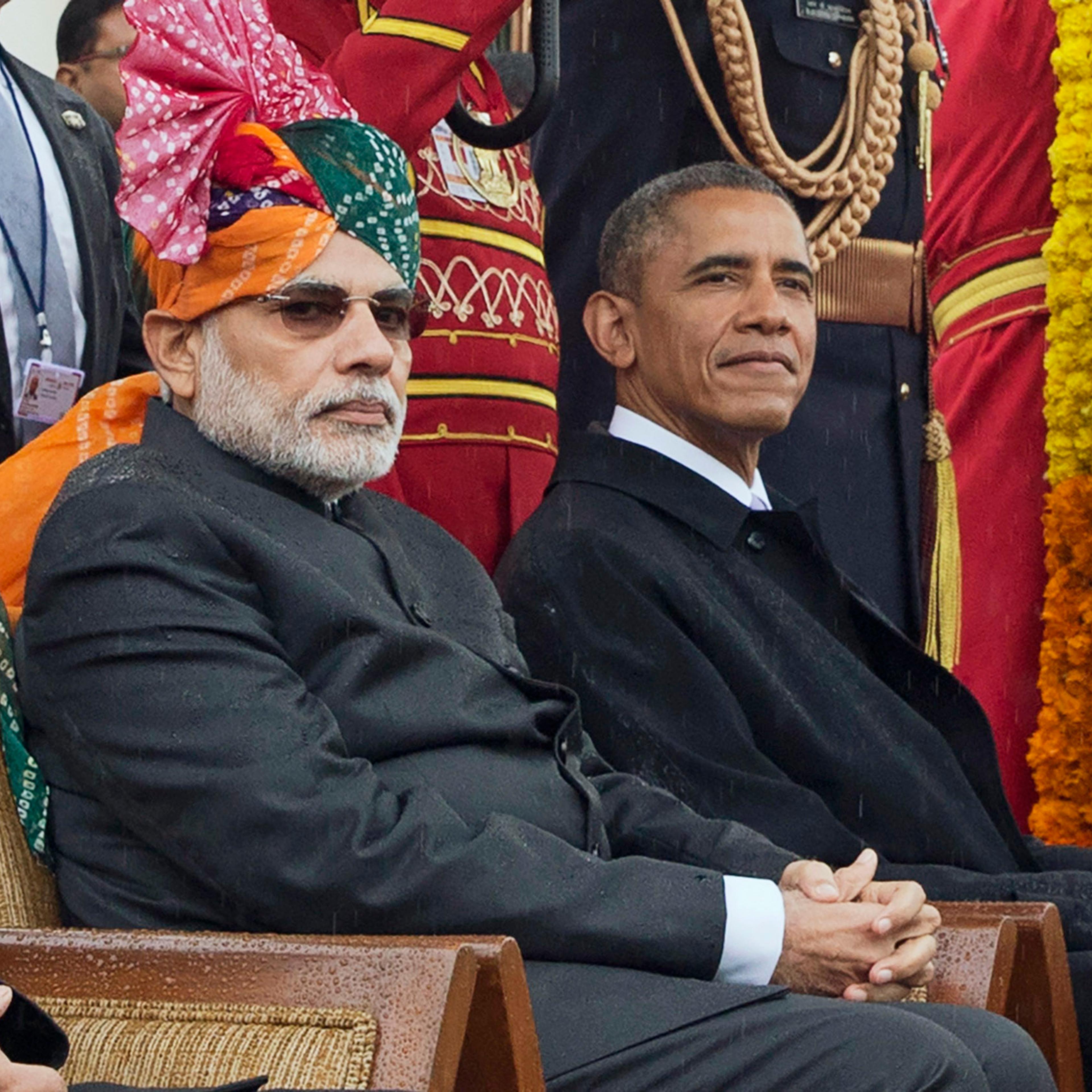 President Barack Obama and Indian Prime Minister Narendra Modi watch a parade and award ceremony during India's Republic Day celebration in New Delhi.