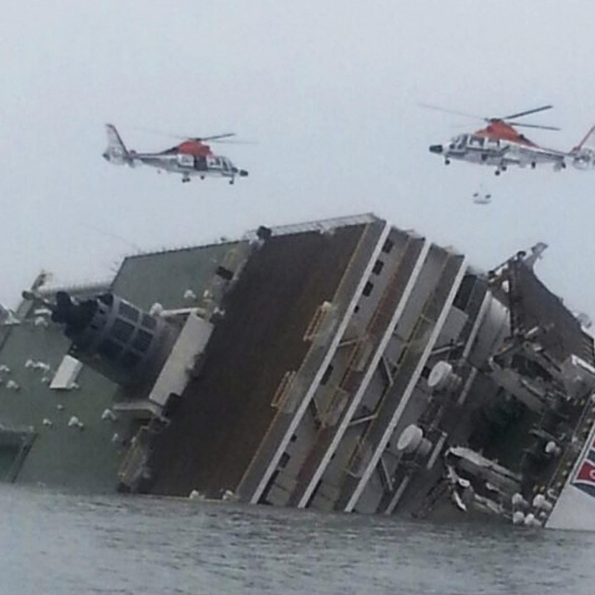 Rescue helicopters flying over the passenger ship Sewol as it sinks in waters off South Korea's southwestern coast on April 16, 2014.