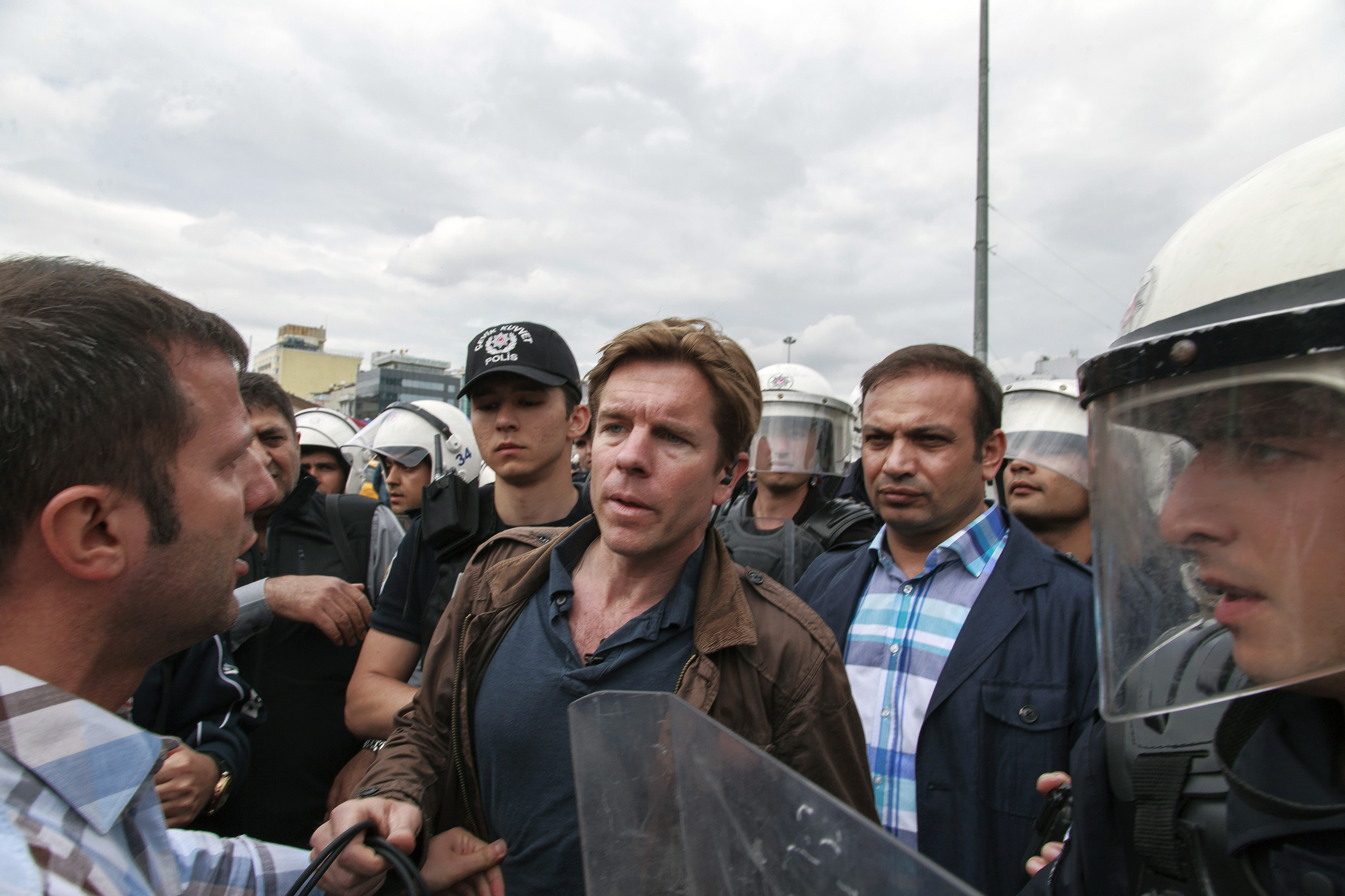 Riot police detain Ivan Watson, CNN Turkey correspondent, in Taksim Square during his live reporting in Istanbul on May 31, 2014.