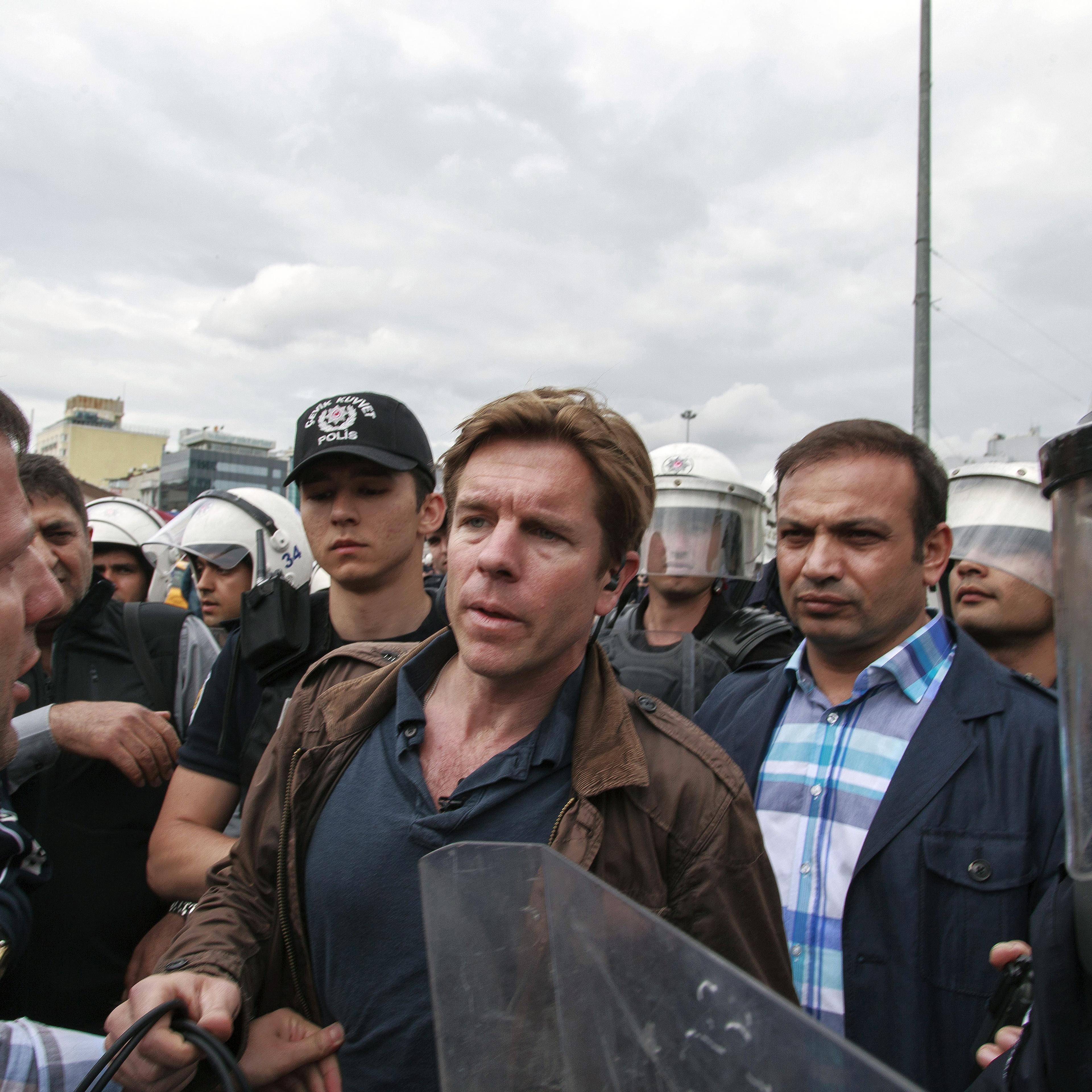 Riot police detain Ivan Watson, CNN Turkey correspondent, in Taksim Square during his live reporting in Istanbul on May 31, 2014.