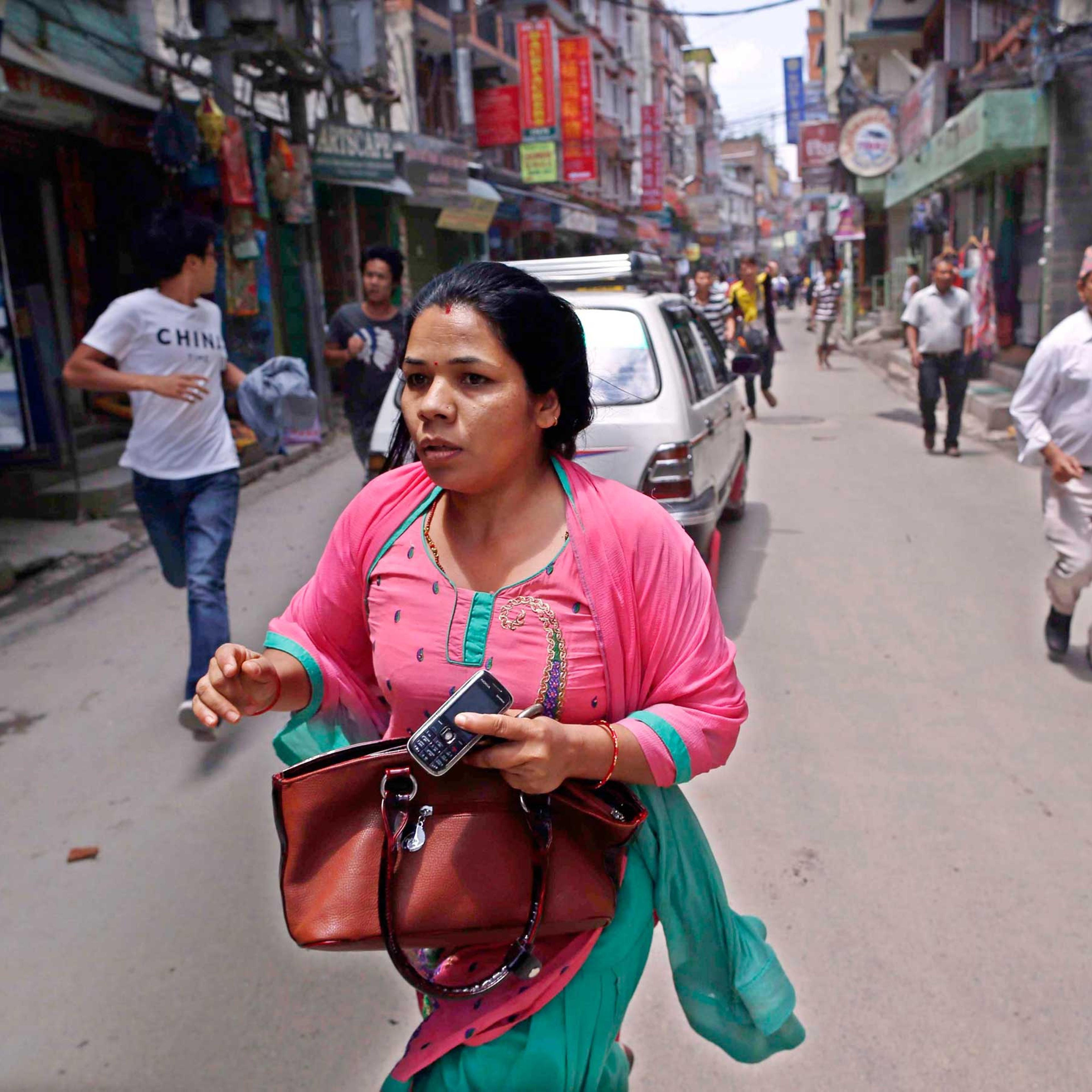 Nepalese search for open space as a strong earthquake hits Kathmandu on May 12, 2015.