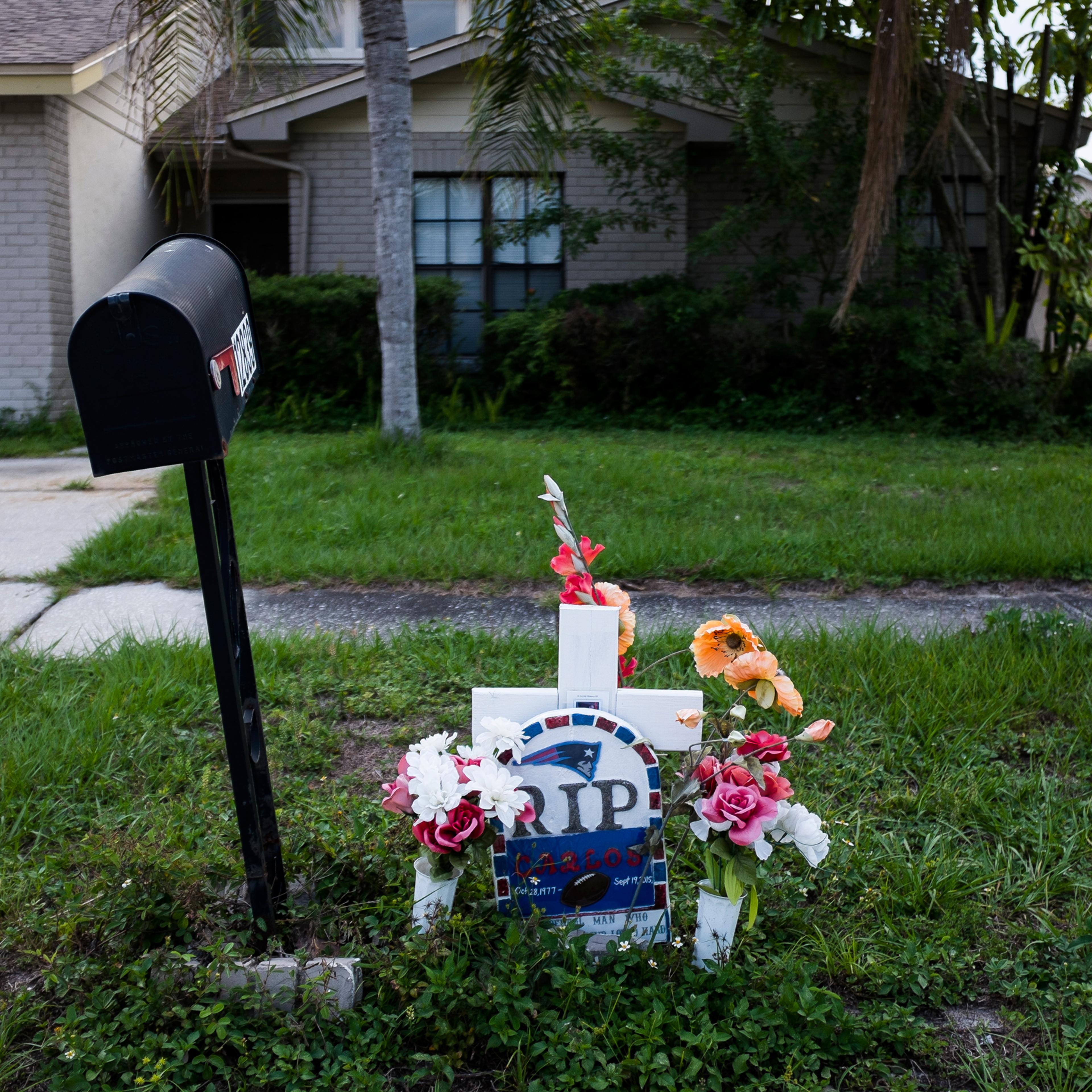 This Sept. 15, 2016 photo shows a memorial for Carlos Garica which has sat outside Yaileen Ayala's home for the last year. It marks where her ex-husband died after he was shot following an argument with a neighbor. (Zack Wittman/The Tampa Bay Times via A