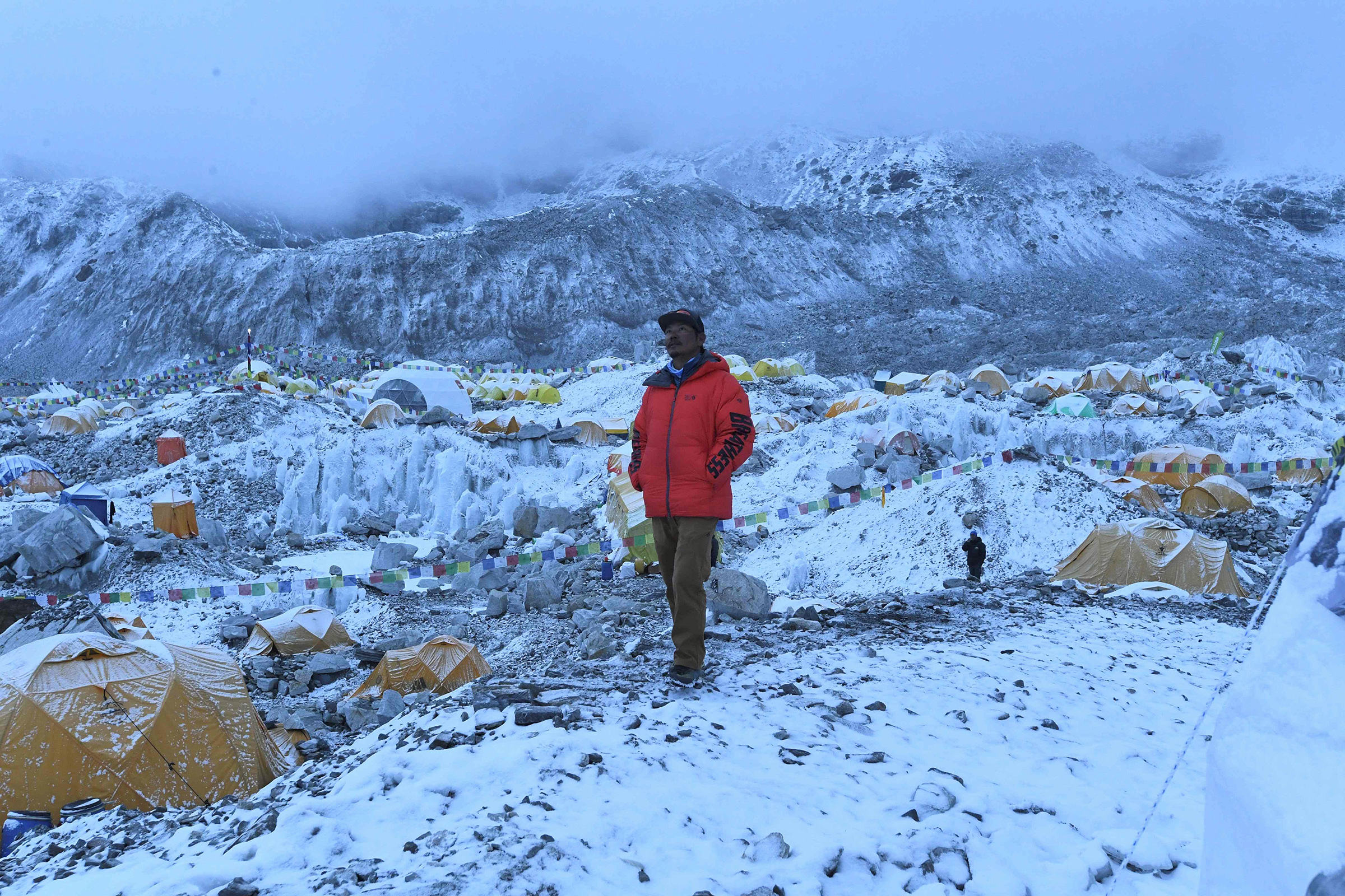 Mountaineer and expedition manager Tashi Lakpa Sherpa poses for a picture on May 1 at Everest base camp. A coronavirus outbreak on Mount Everest has seen dozens of people evacuated by helicopter from the foot of the world's highest peak, derailing Nepal'