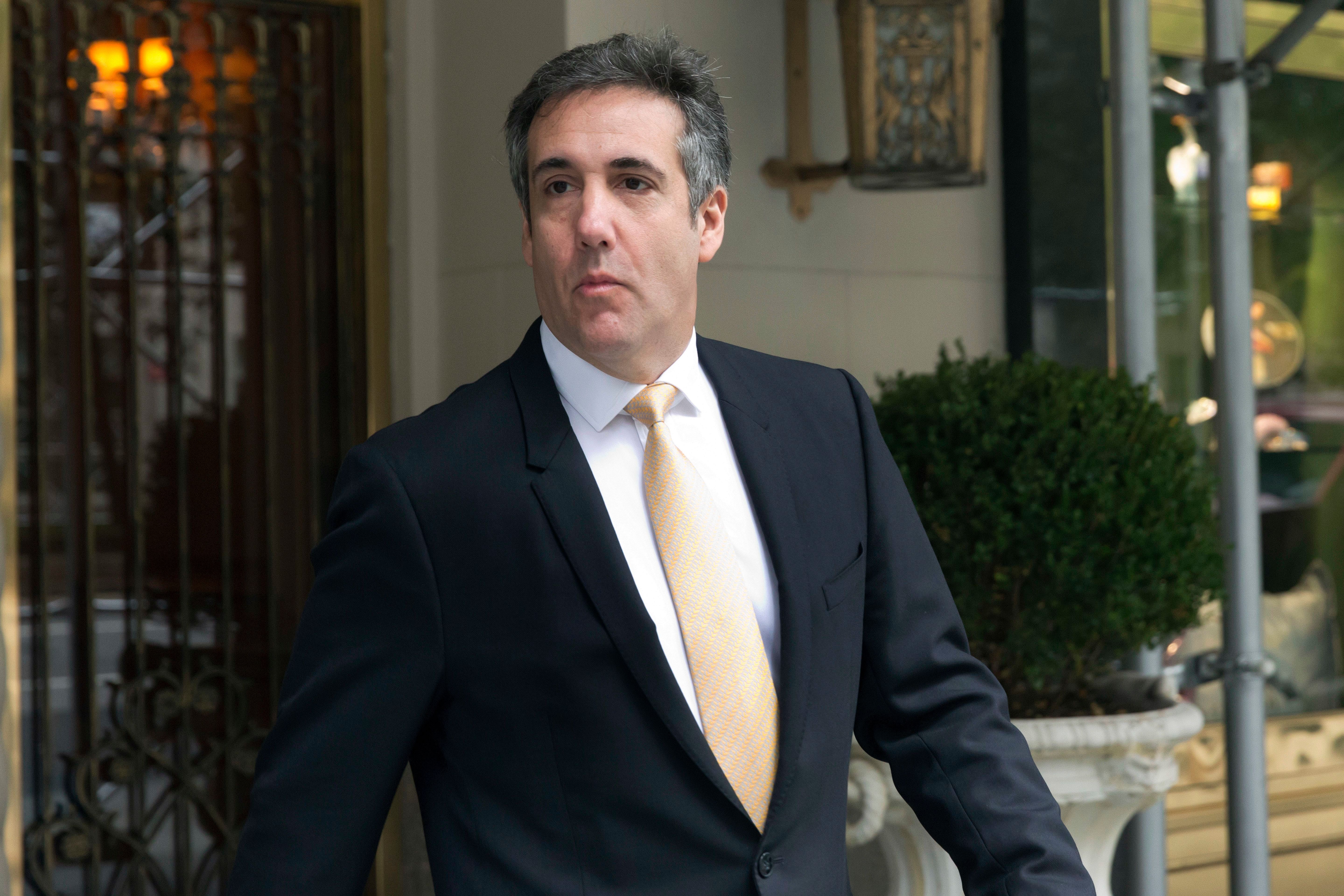 Michael Cohen leaving his apartment building