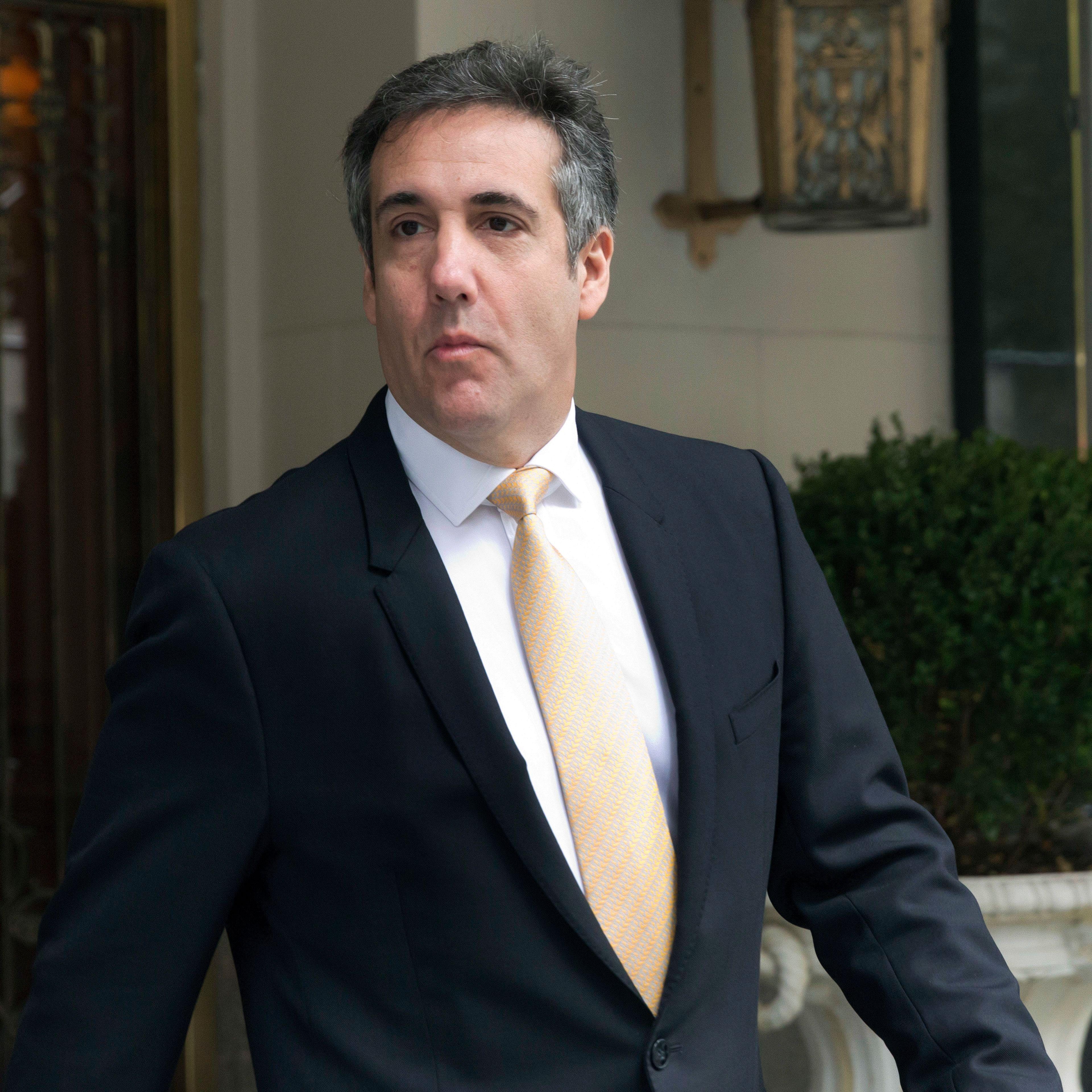 Michael Cohen leaving his apartment building