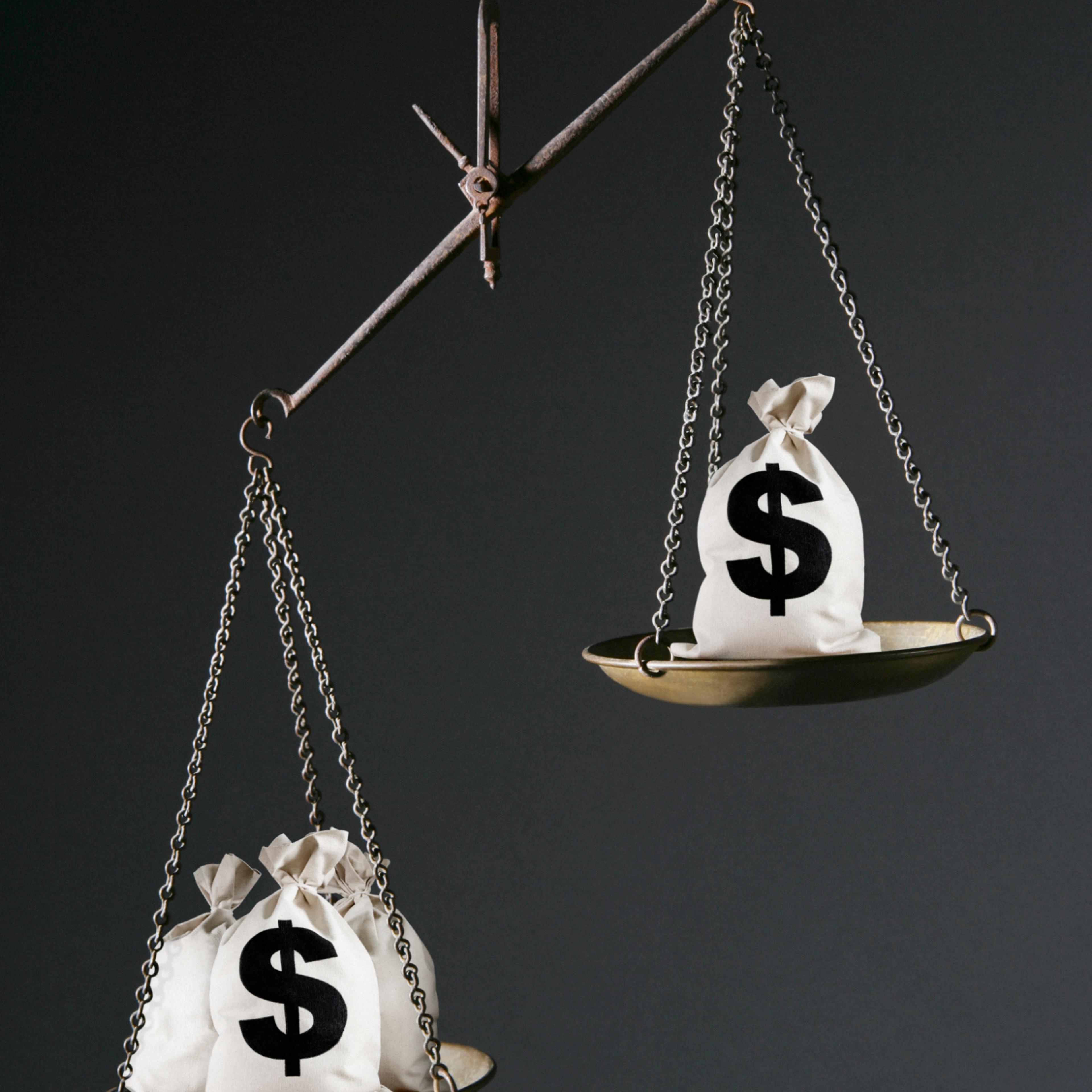income-inequality-money-bags-scale