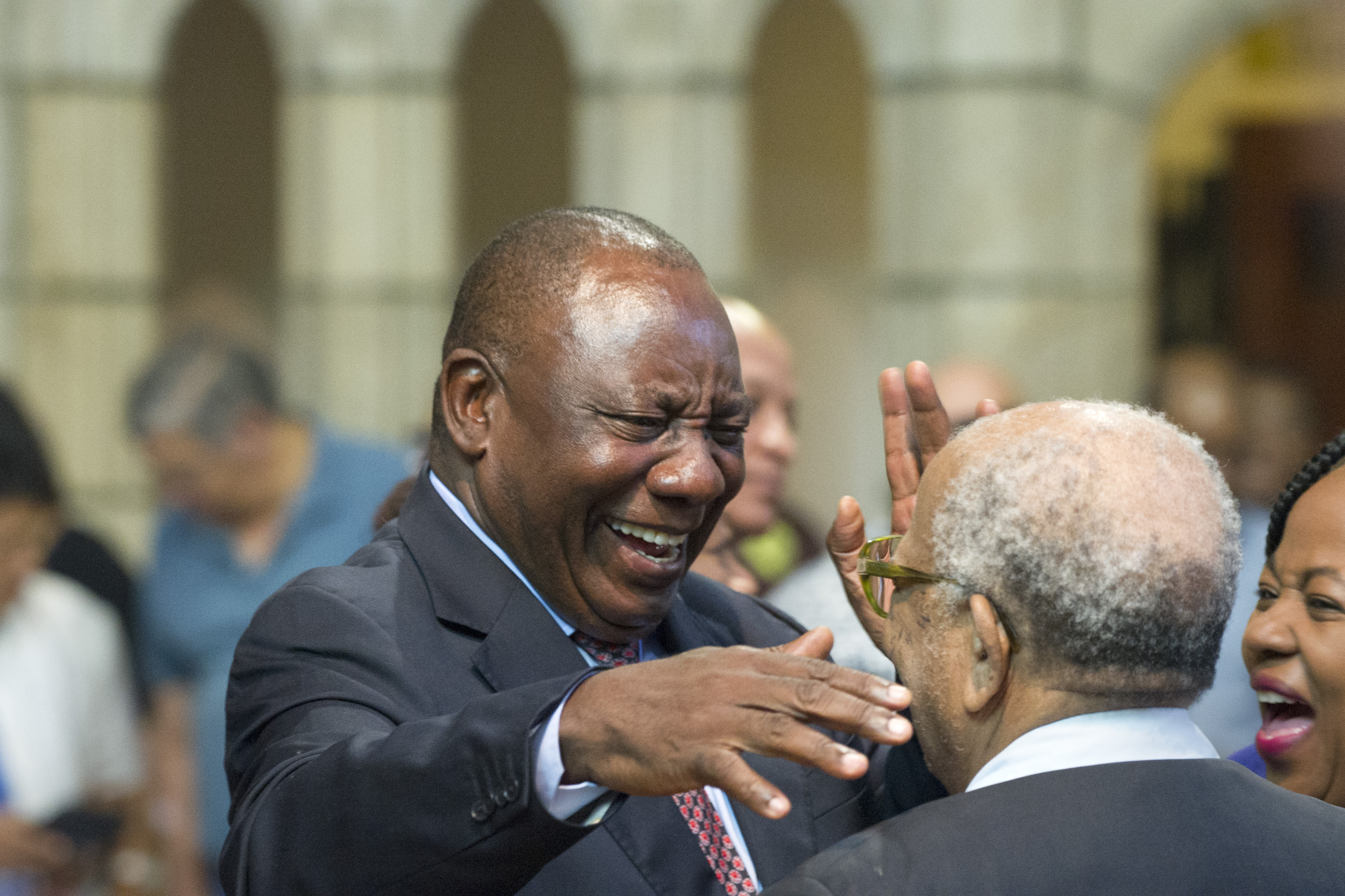 Cyril Ramaphosa (C), South African Deputy president, and newly elected president of the ruling African National Congress (ANC) greets people during a church service at St Georges Cathedral, on February 11, 2018, in Cape Town.