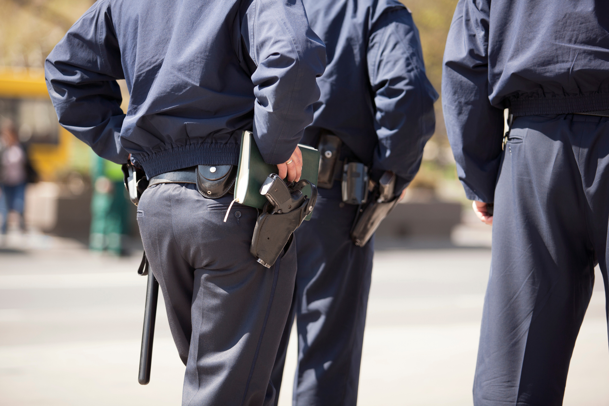 Rear Midsection Of Police Force On Street