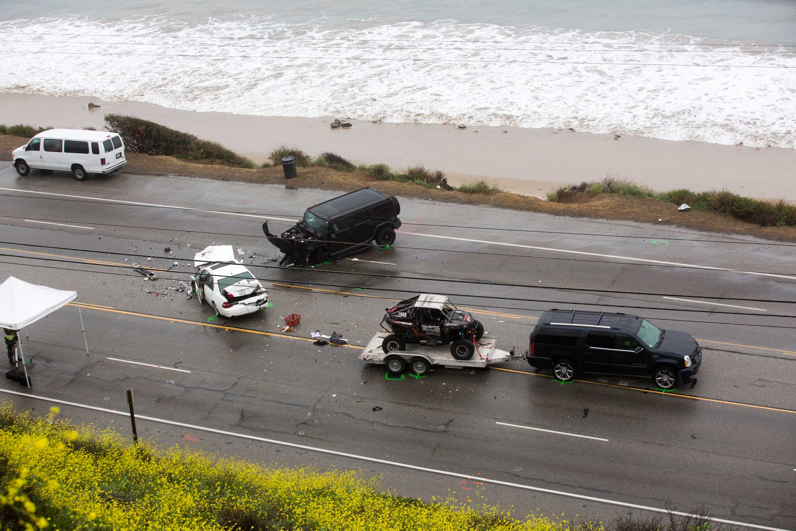 The SUV with a trailer, belonging to Reality-TV star Bruce Jenner, is seen at the scene of a car crash where one person was killed and at least seven others were injured in Malibu, Calif. Feb. 7, 2015.