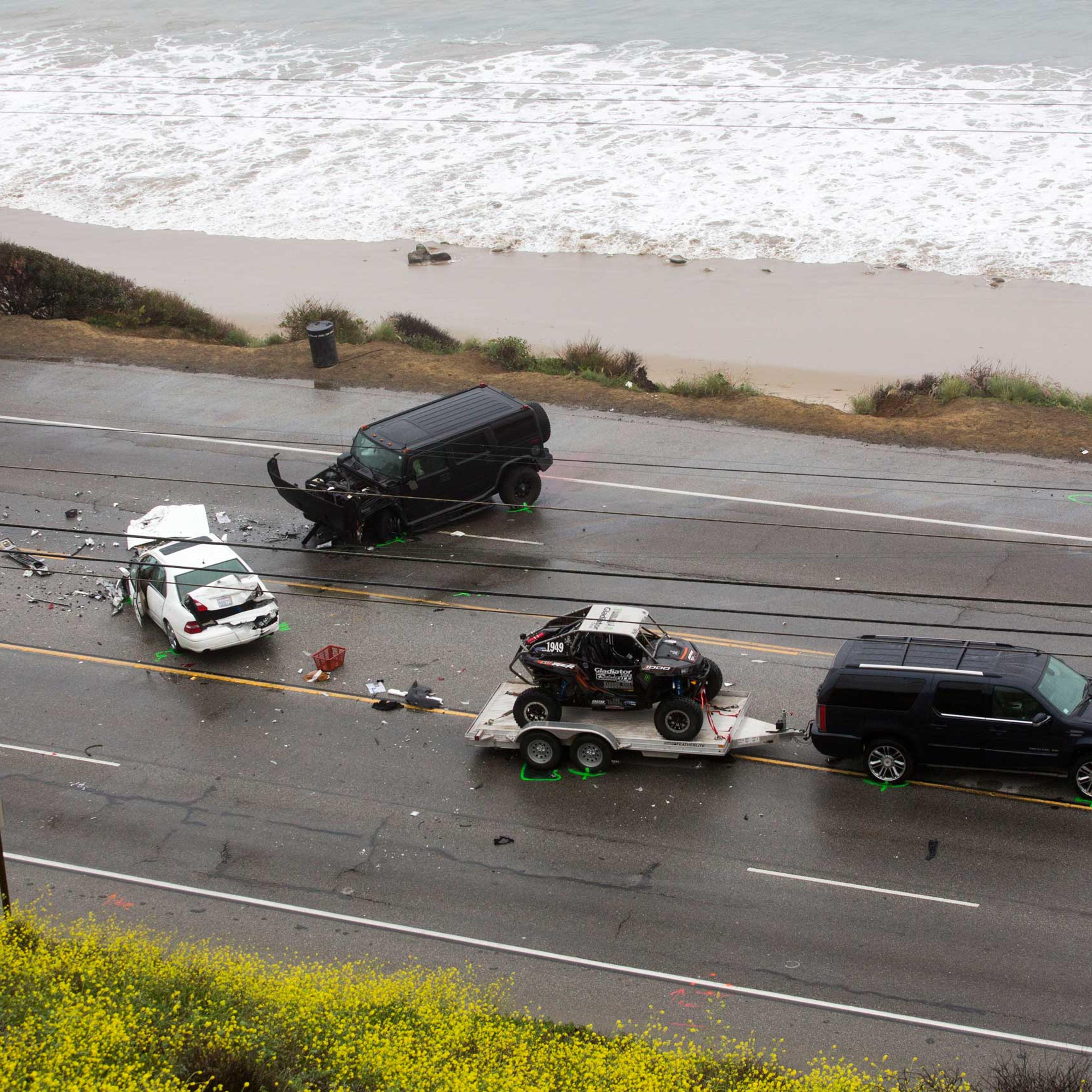 The SUV with a trailer, belonging to Reality-TV star Bruce Jenner, is seen at the scene of a car crash where one person was killed and at least seven others were injured in Malibu, Calif. Feb. 7, 2015.