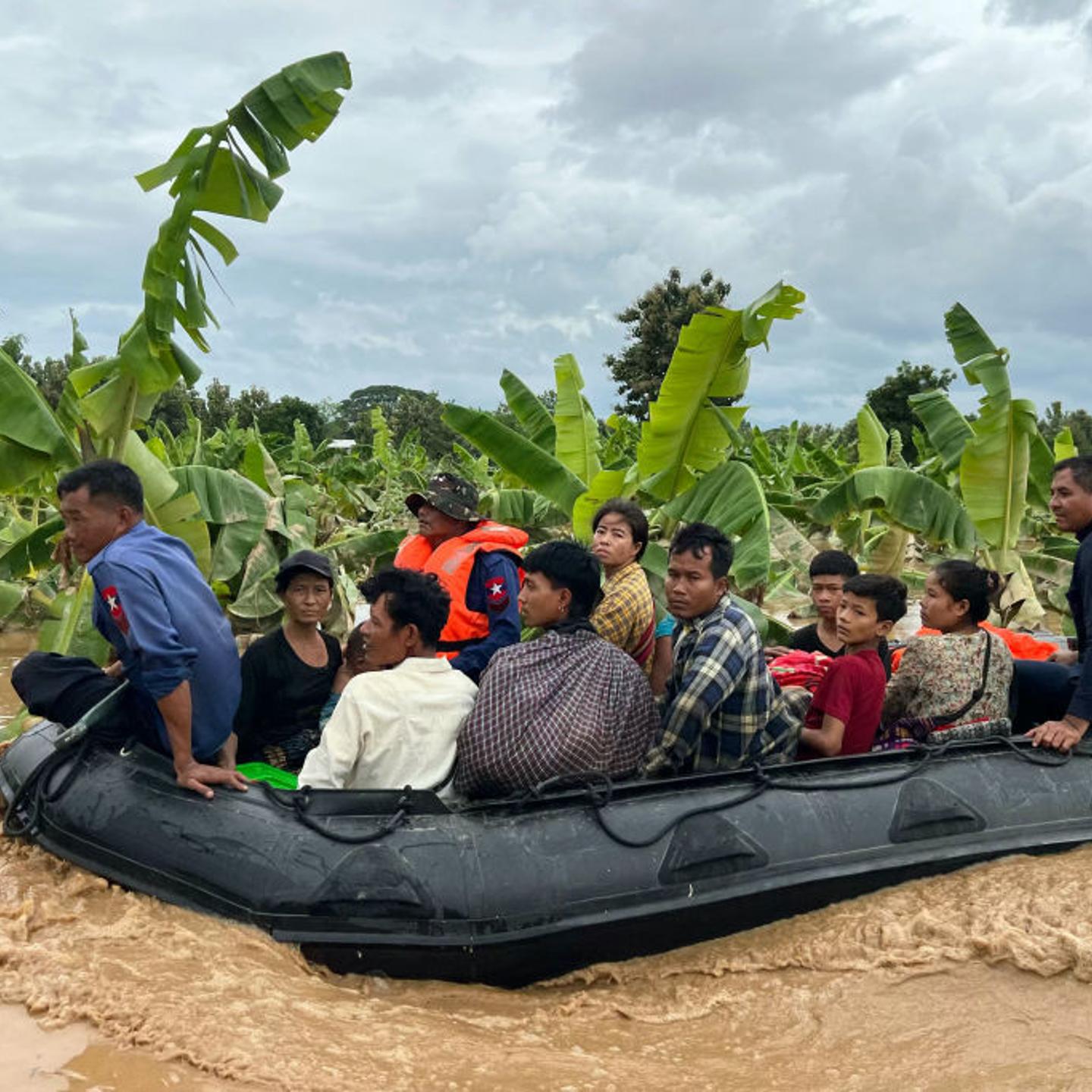 Residents are transported on a boat through flood waters in Sin Thay village in Pyinmana, in Myanmar's Naypyidaw region, on Sept. 13, 2024.
