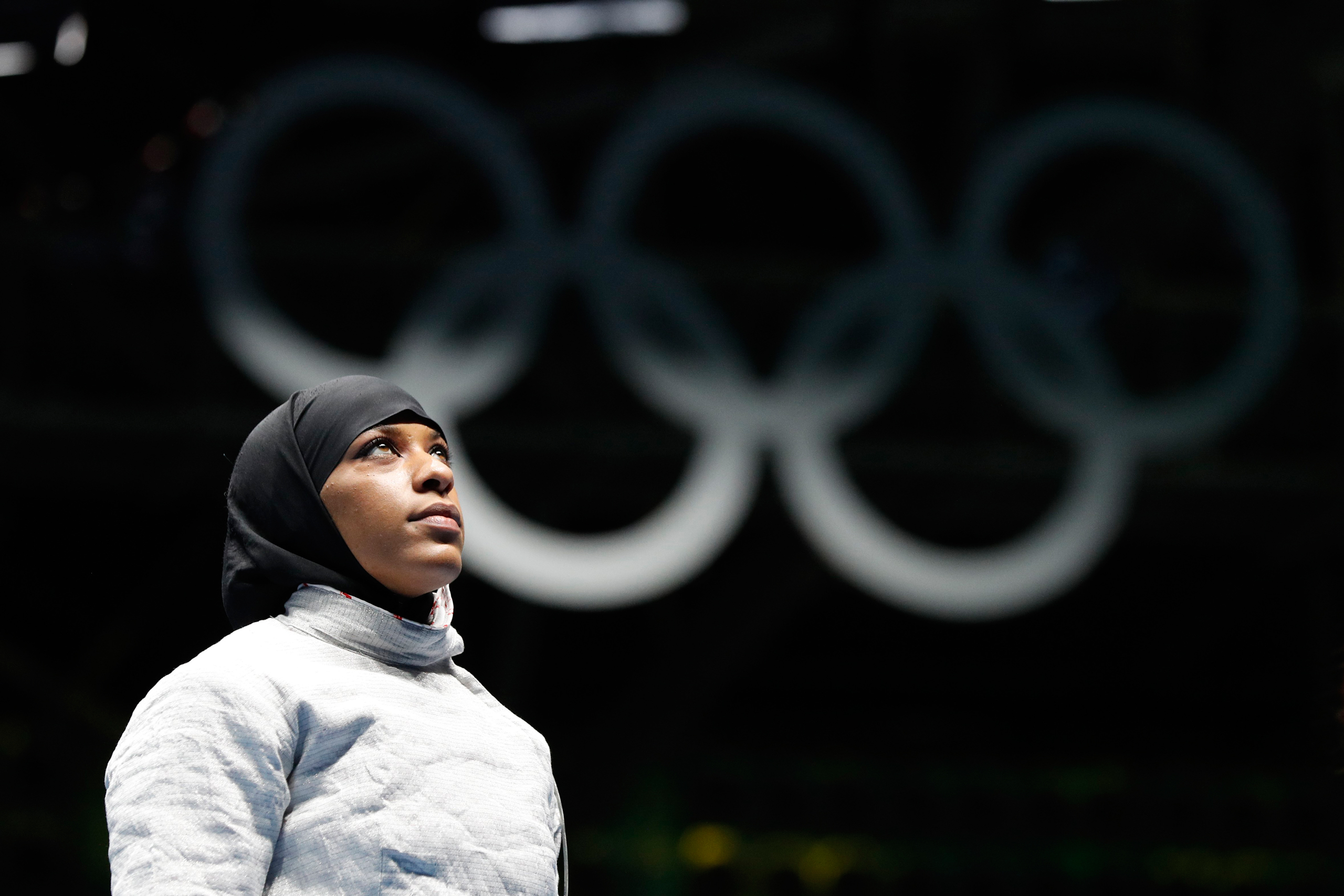 CORRECTS FIRST NAME TO IBTIHAJ FROM UBRIHAJ - Ibtihaj Muhammad, from United States, waits for match against Olena Kravatska from Ukraine, in the women's saber individual fencing event at the 2016 Summer Olympics in Rio de Janeiro, Brazil, Monday, Aug. 8,