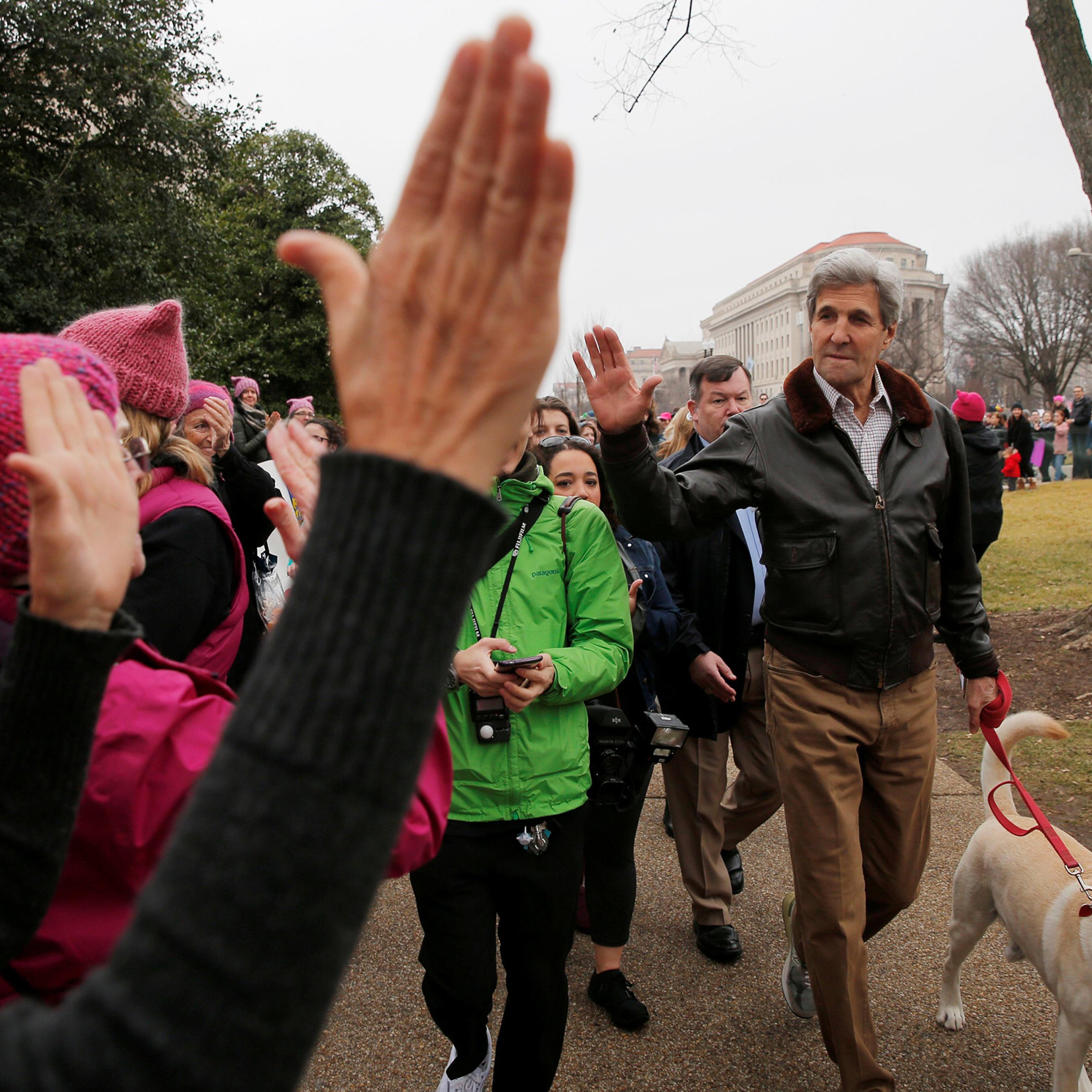 Former U.S. Secretary of State John Kerry walks his dog to join the Women's March on Washington, following the inauguration of U.S. President Donald Trump, on Jan. 21, 2017.