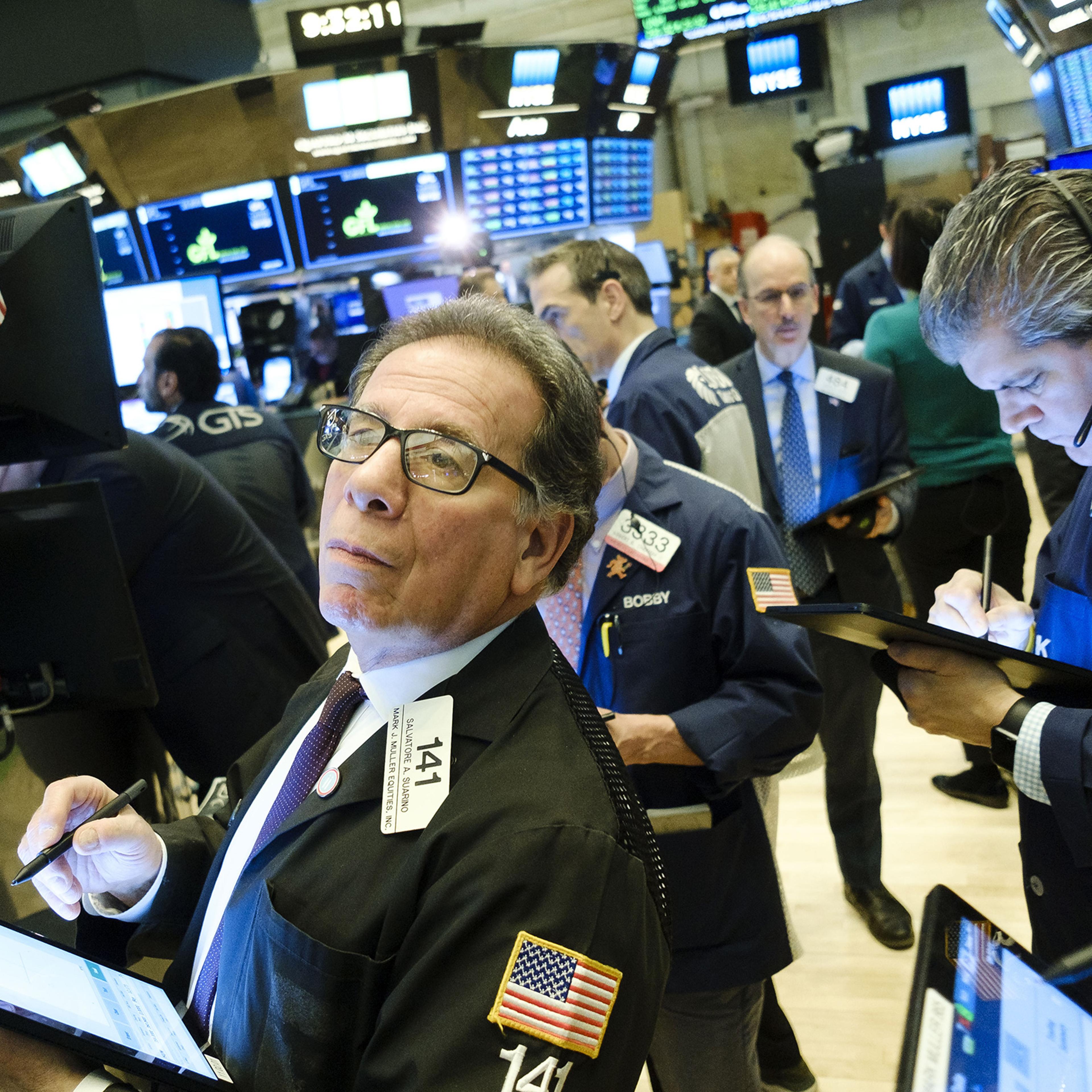 Traders work on the floor of the New York Stock Exchange on Mar. 4