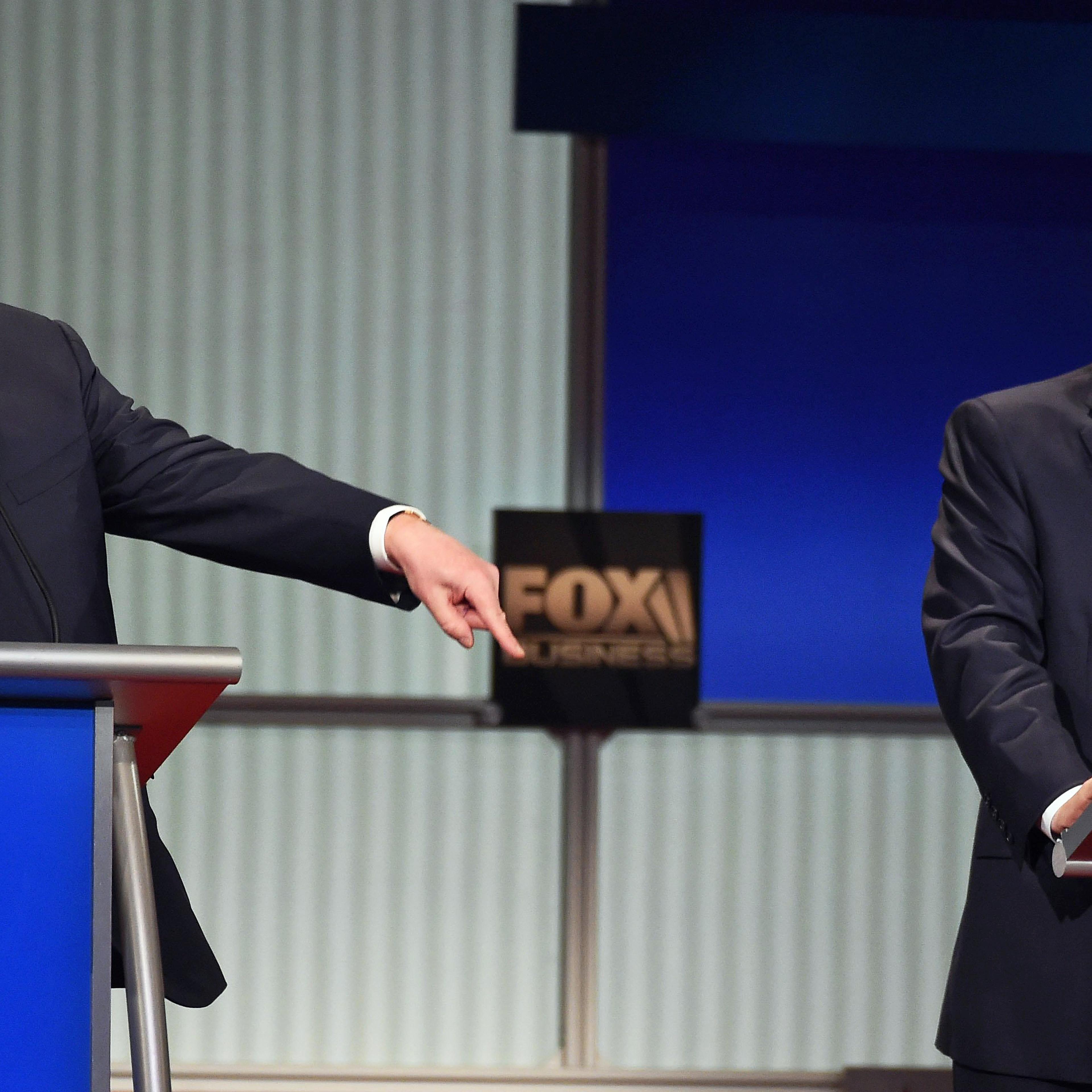 Republican presidential candidate, businessman Donald Trump speaks as Republican presidential candidate, Sen. Ted Cruz, R-Texas, looks on during the Republican presidential debate at the North Charleston Coliseum, Thursday, Jan. 14, 2016, in North Charle