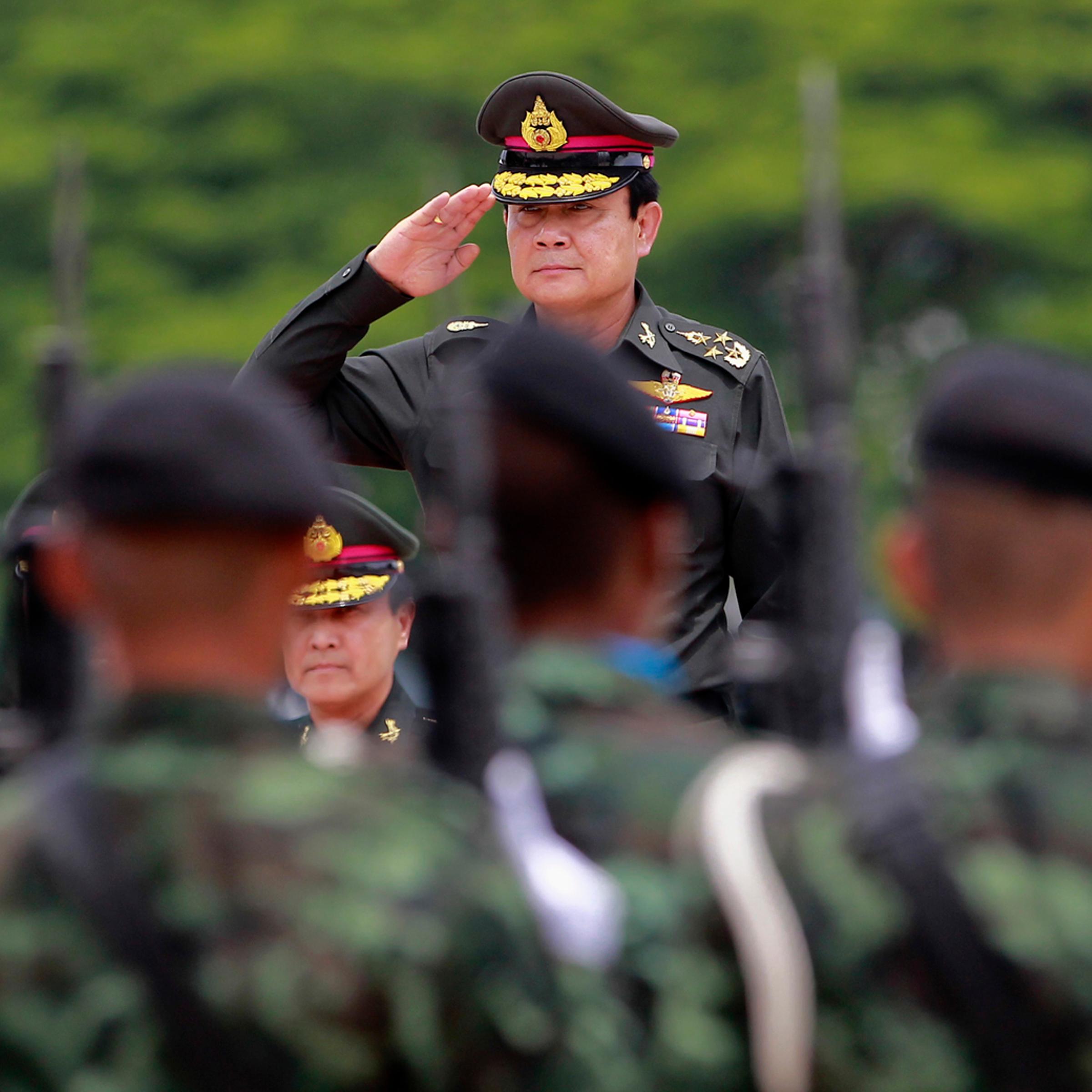 Thailand's newly appointed Prime Minister Chan-ocha reviews honor guards during his visit at the 2nd Infantry Battalion, 21st Infantry Regiment, Queen's Guard in Chonburi province, on the outskirts of Bangkok