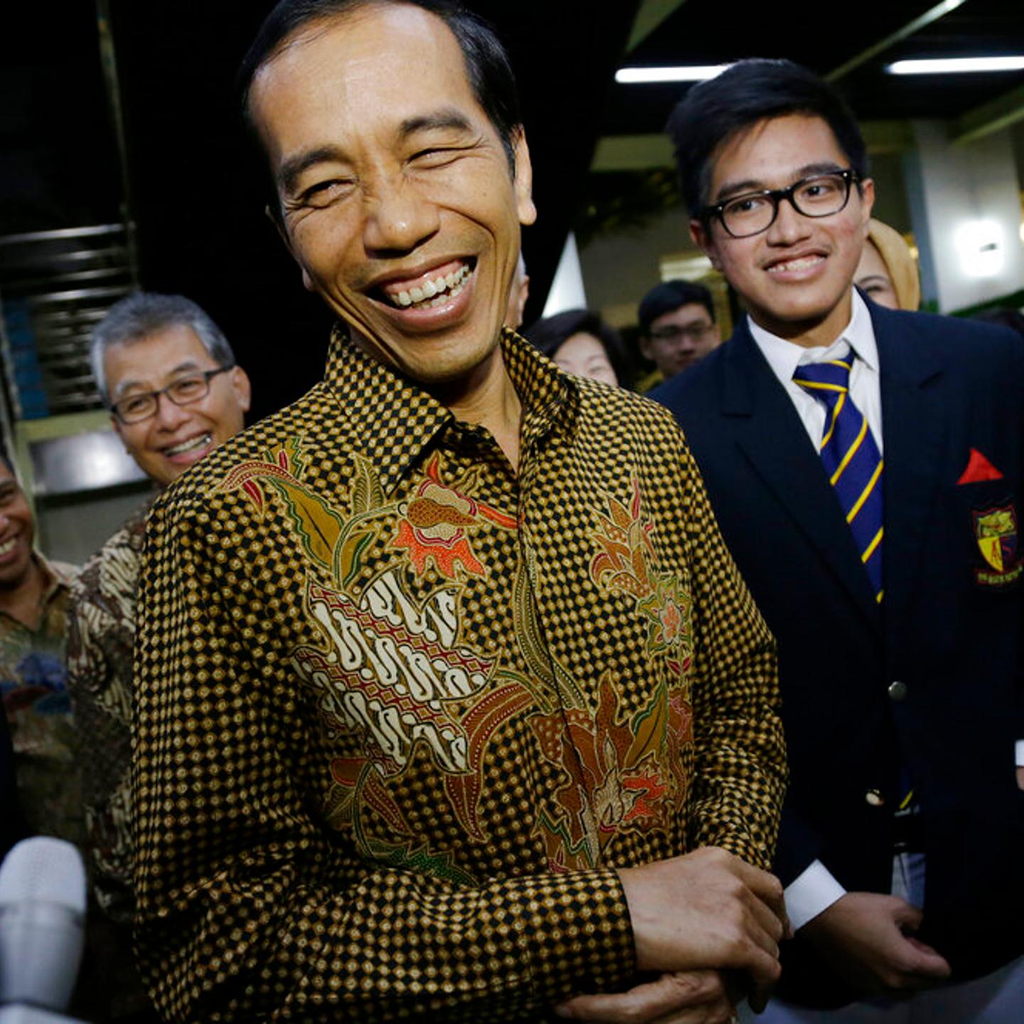 Indonesian President Joko Widodo at the graduation ceremony of his youngest son Kaesang Pangarep in Singapore, Nov. 21, 2014.