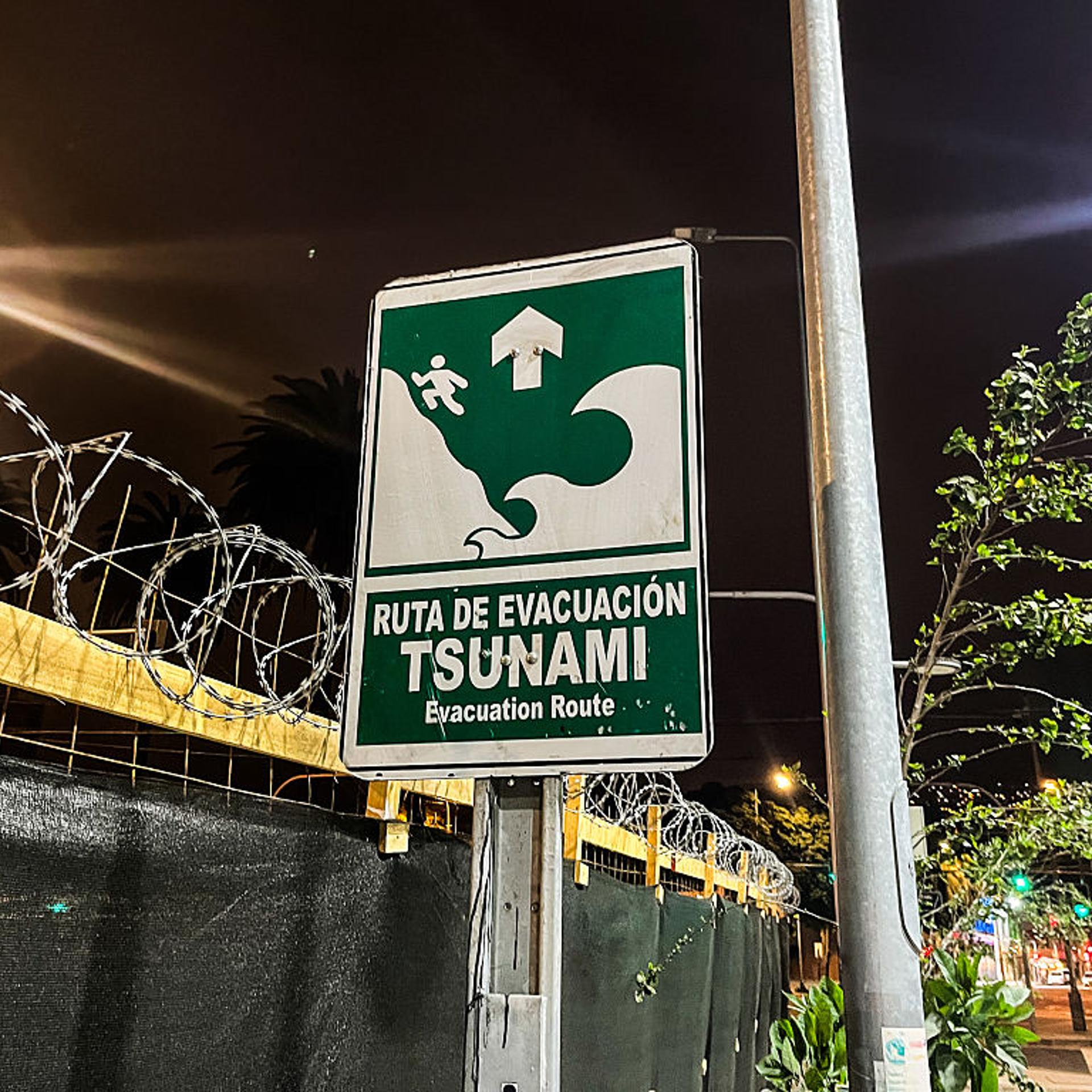 A sign of a Tsunami Evacuation Route is seen. Due to an