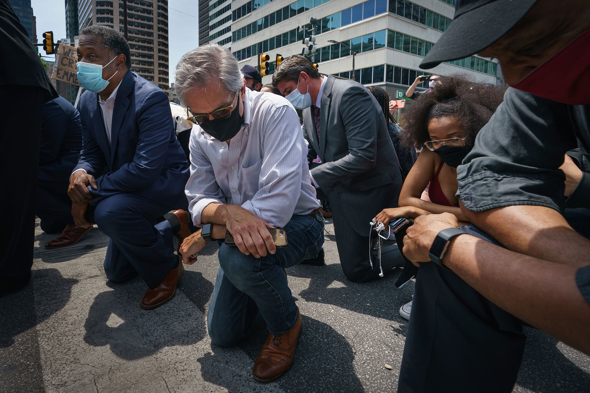 Philadelphia District Attorney Larry Krasner takes a knee in honor of the memory of George Floyda