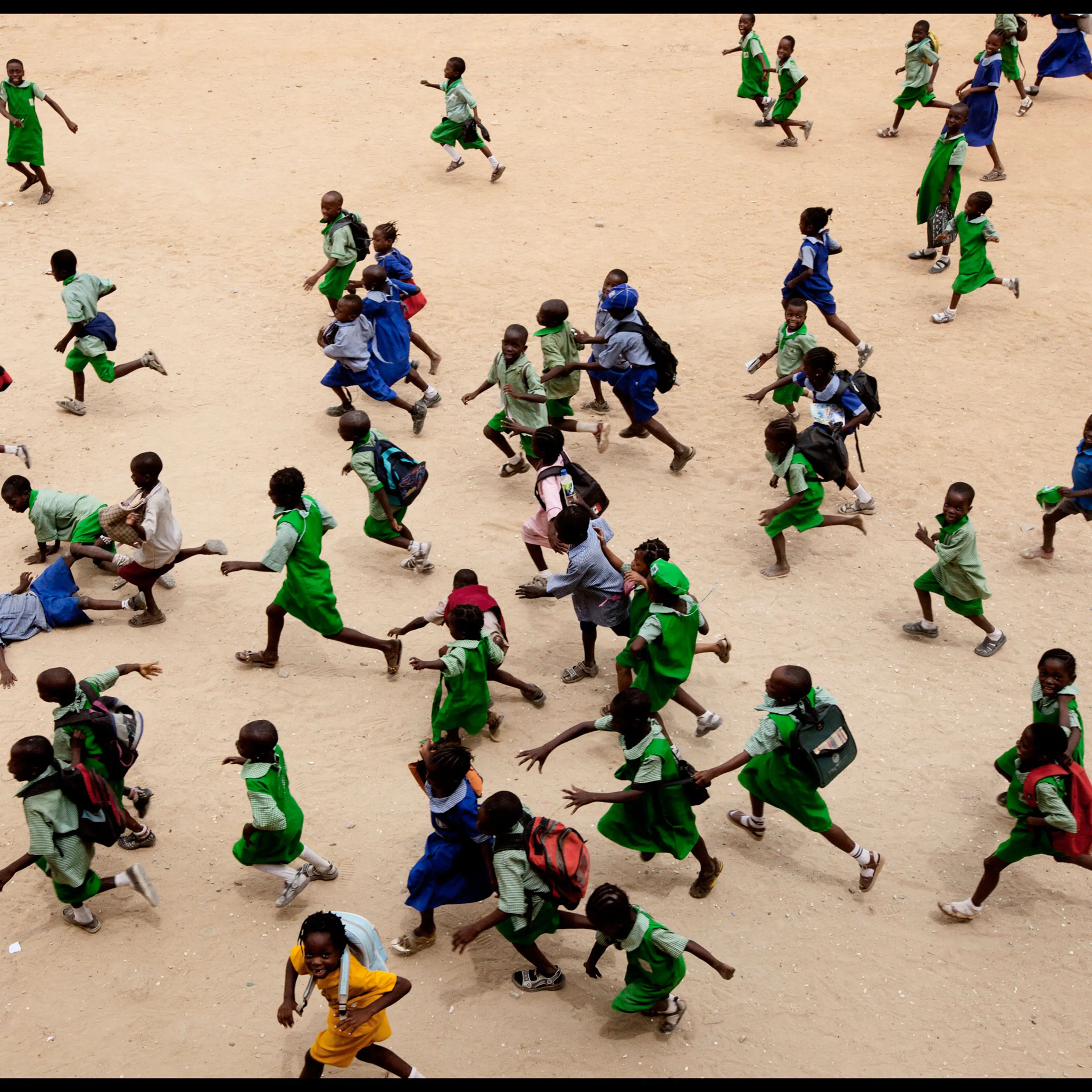 Children run at a school in Lagos. More African kids are finishing primary school, but that’s just the beginning