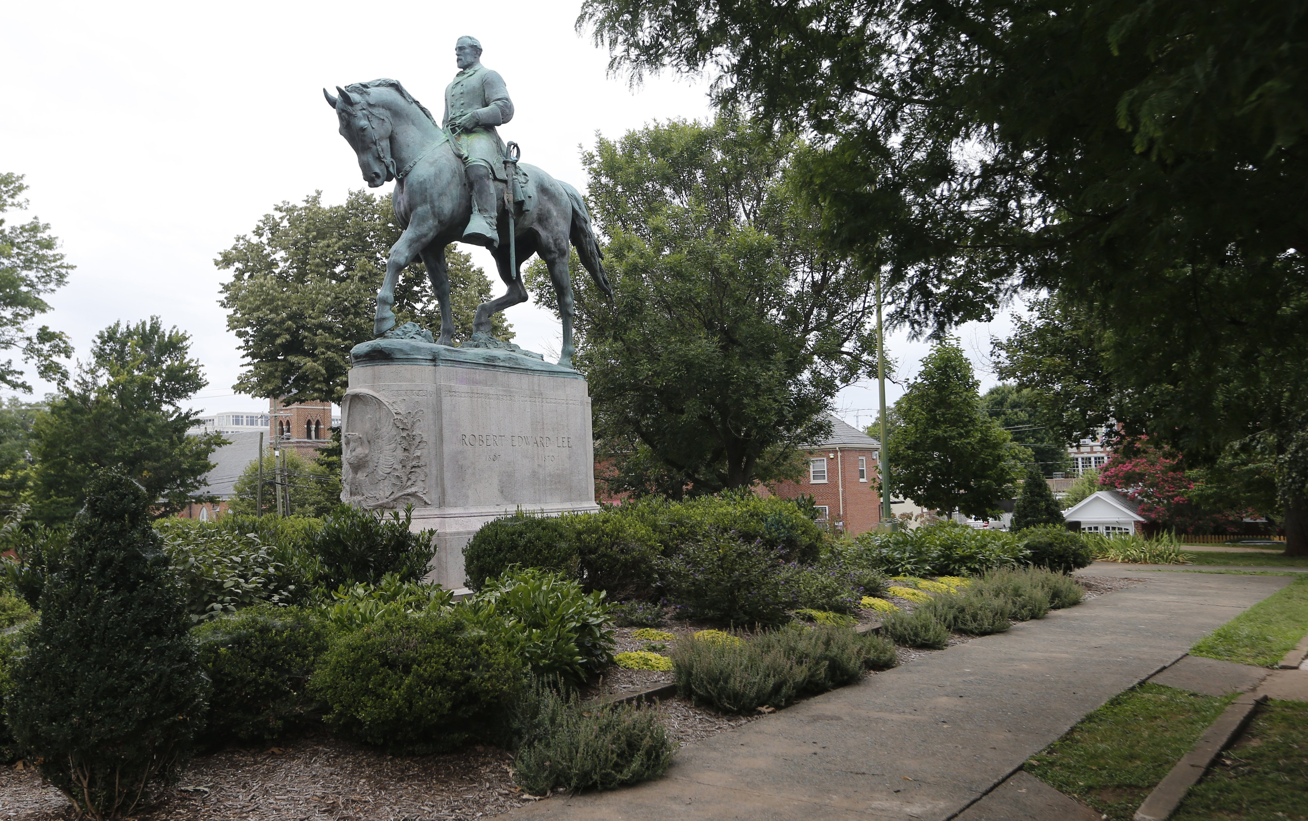 The statue of Confederate General Robert E. Lee still stands in Lee park in Charlottesville, Va. on Aug. 14, 2017.