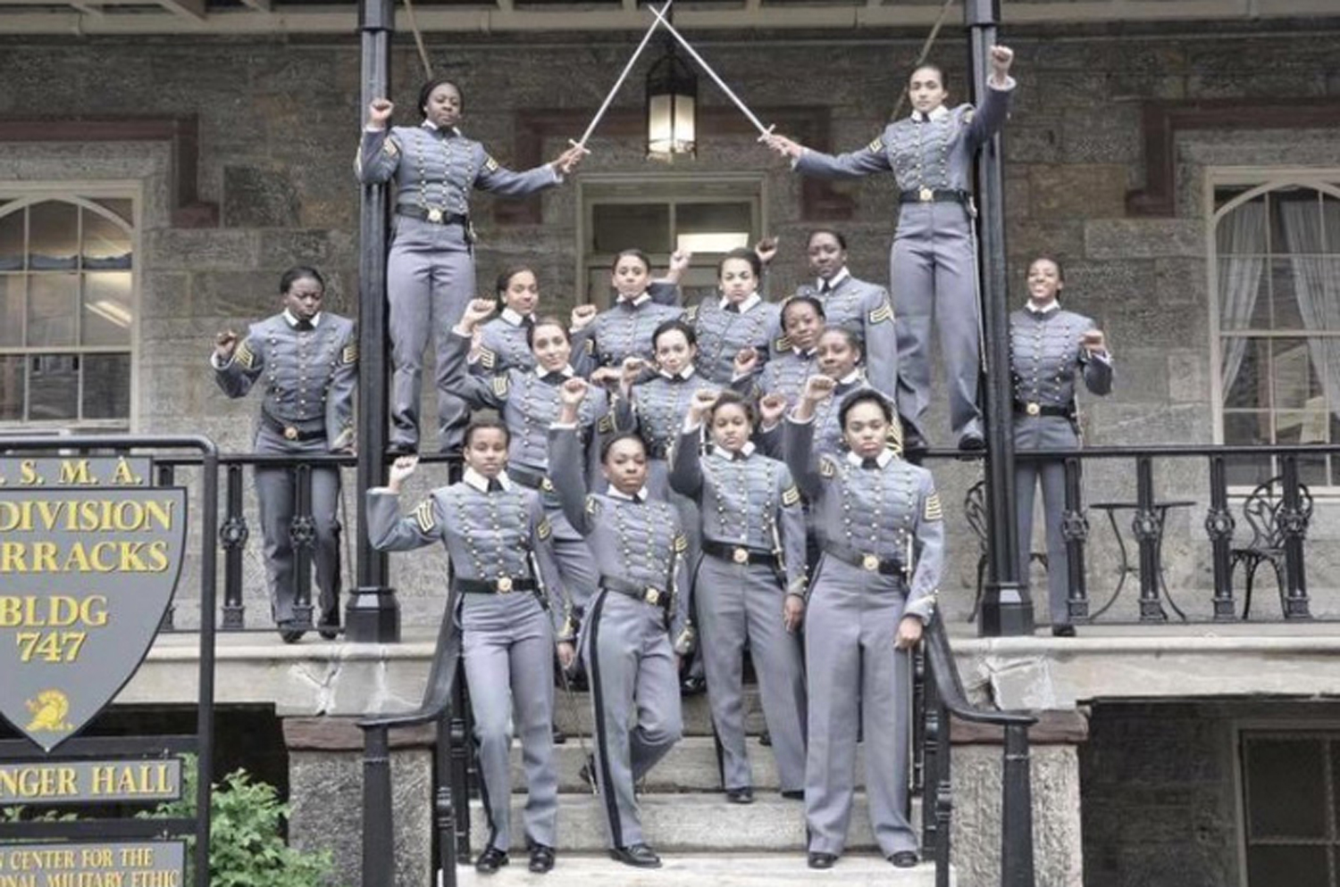 This undated image obtained from Twitter on Saturday, May 7, 2016 shows 16 black, female cadets in uniform with their fists raised while posing for a photograph at the United States Military Academy at West Point, N.Y. The U.S. Military Academy has launc