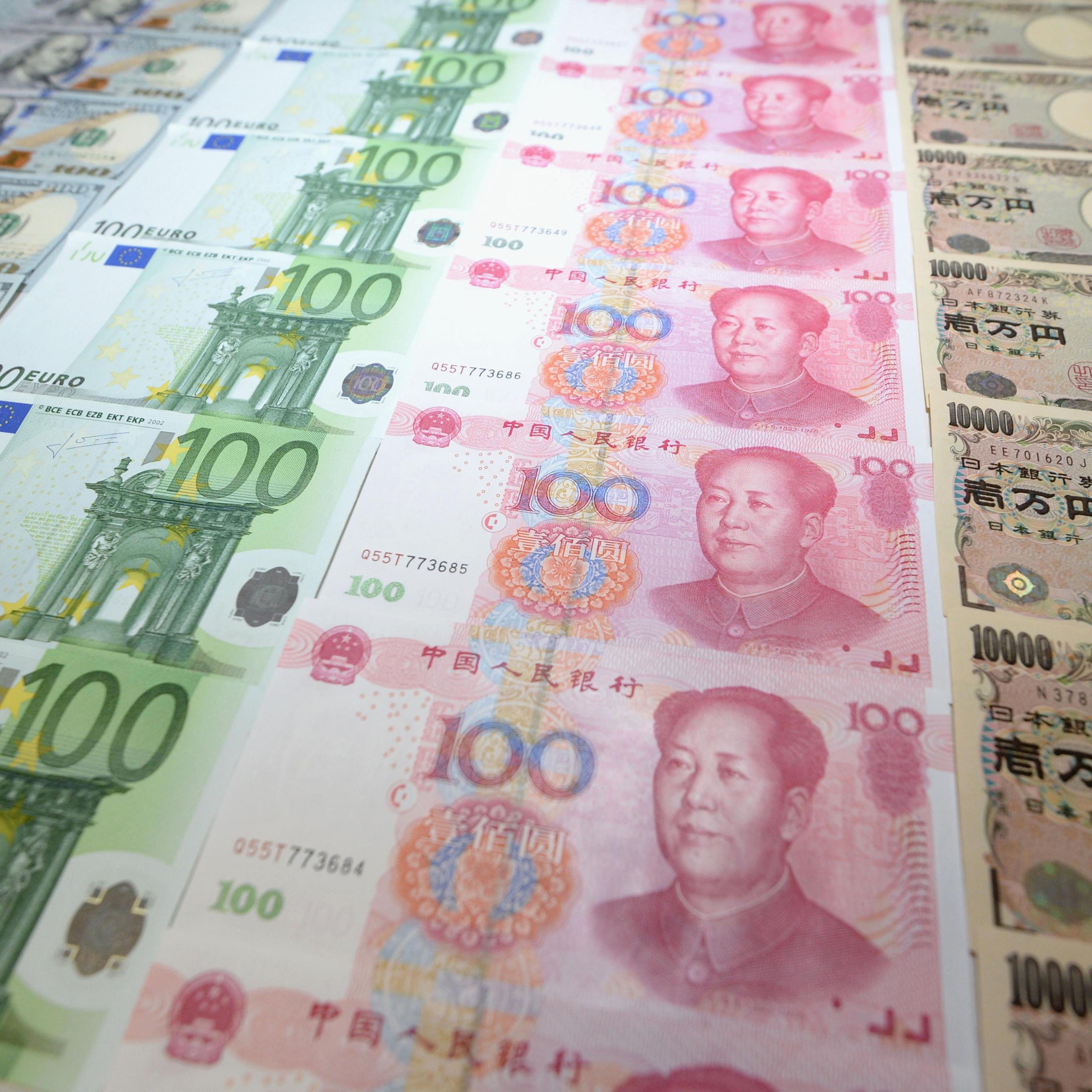 Rows of U.S. dollar, euro, Chinese yuan, and Japanese yen bills, Nov. 30, 2015.