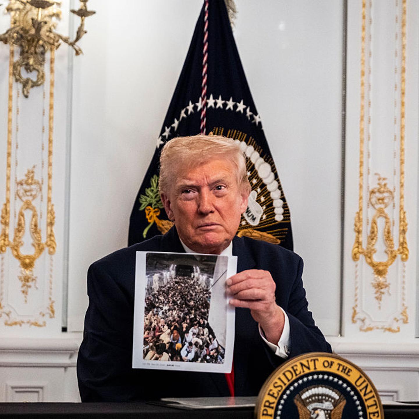 President Donald Trump participates in a call with U.S. service members from his Mar-a-Lago club in Florida on Thanksgiving Day in Palm Beach, Fla. on Nov. 27, 2025.