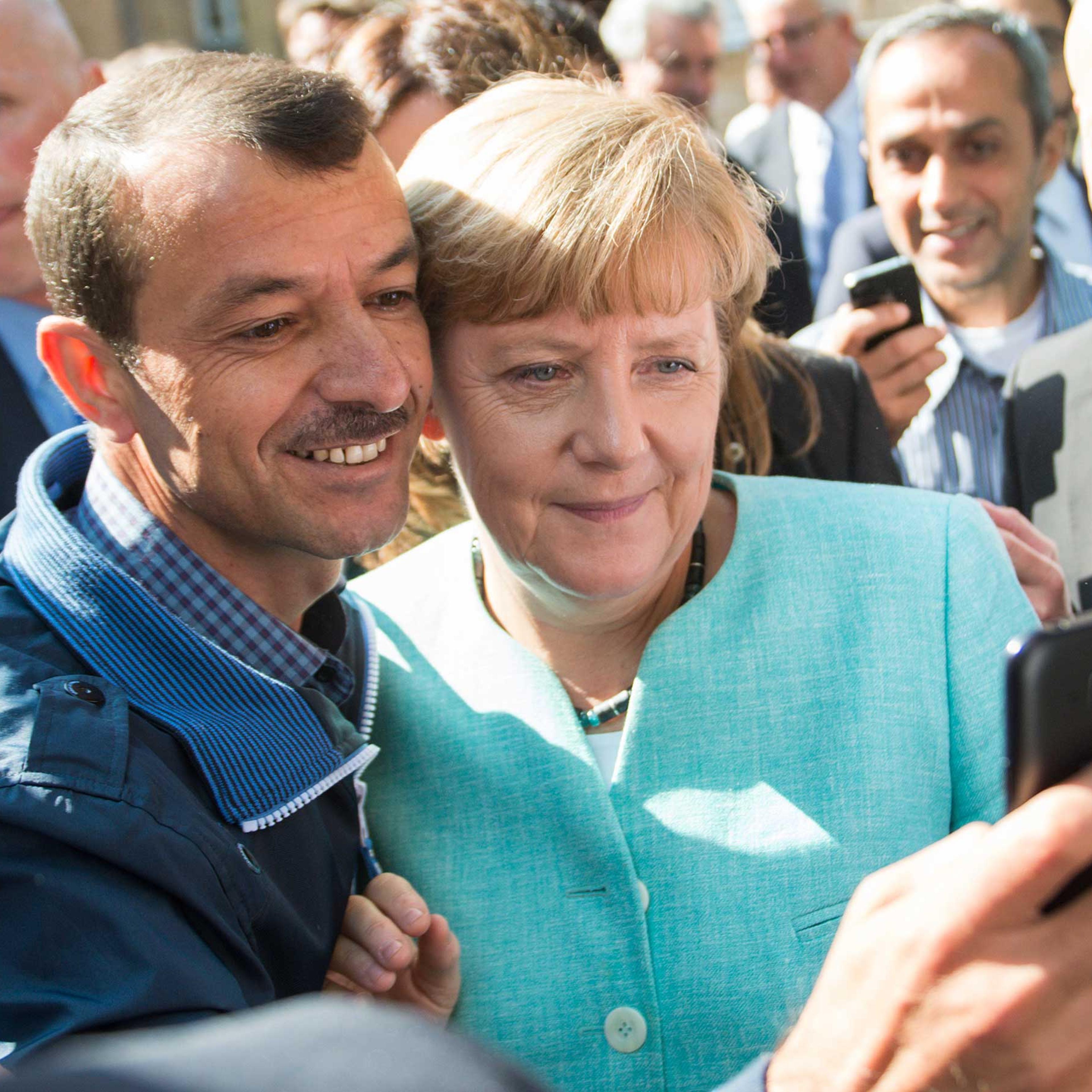 Merkel visits refugee shelter