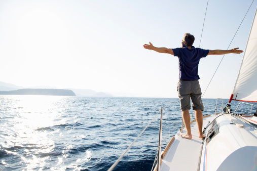 man-yacht-arms-wide-open